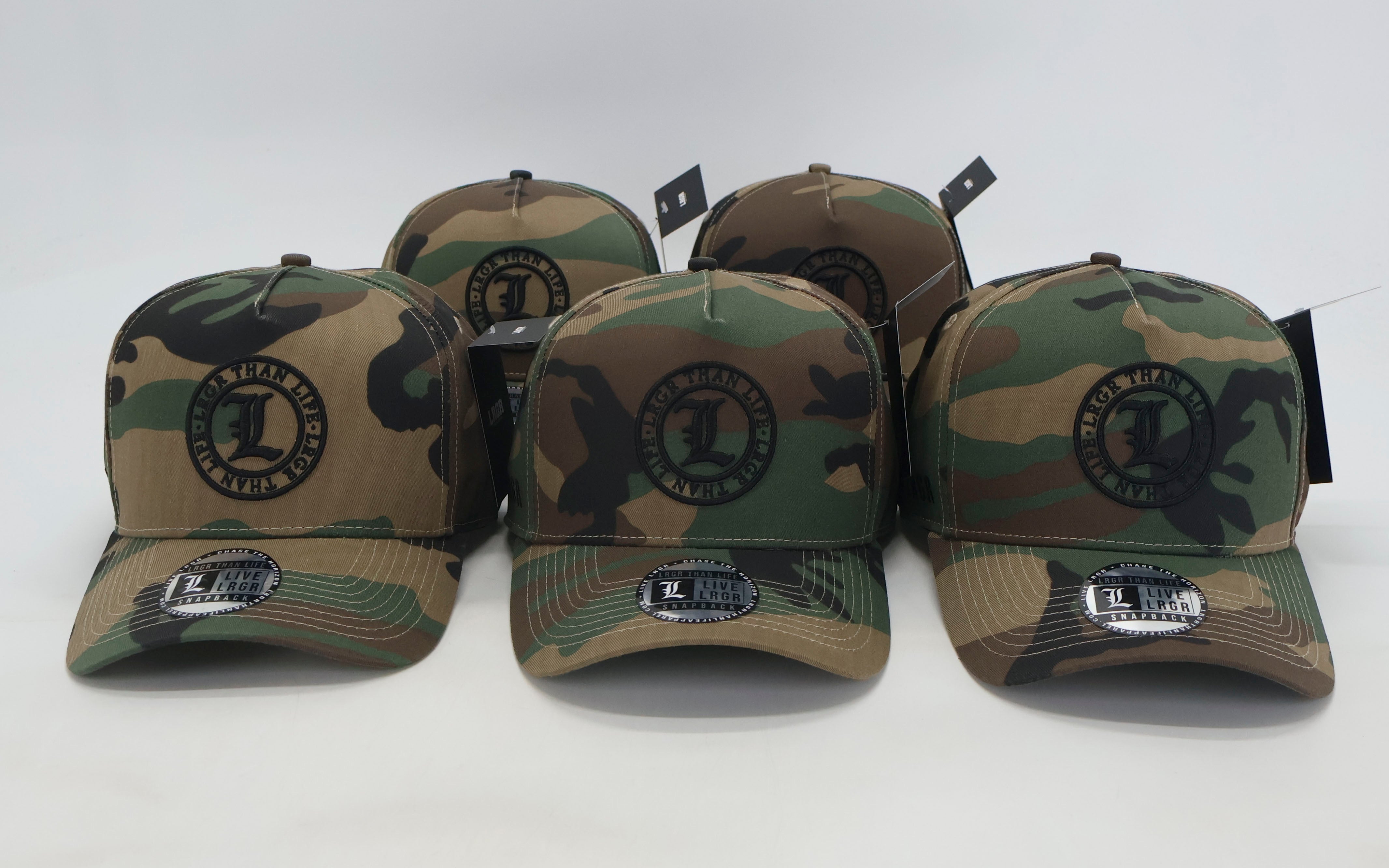 Camouflage baseball caps with logos on a white background