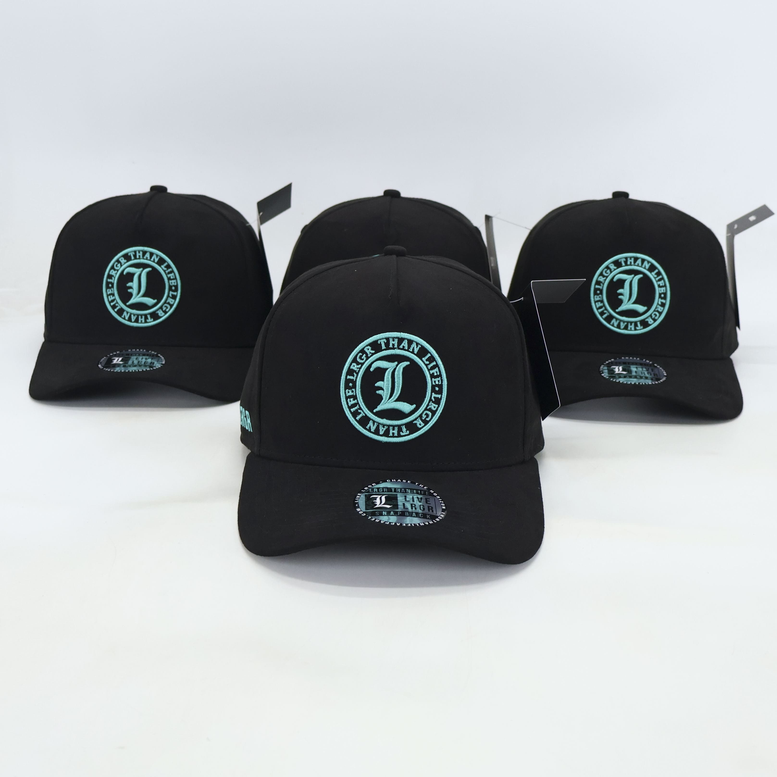 Black baseball caps with green logos on a white background