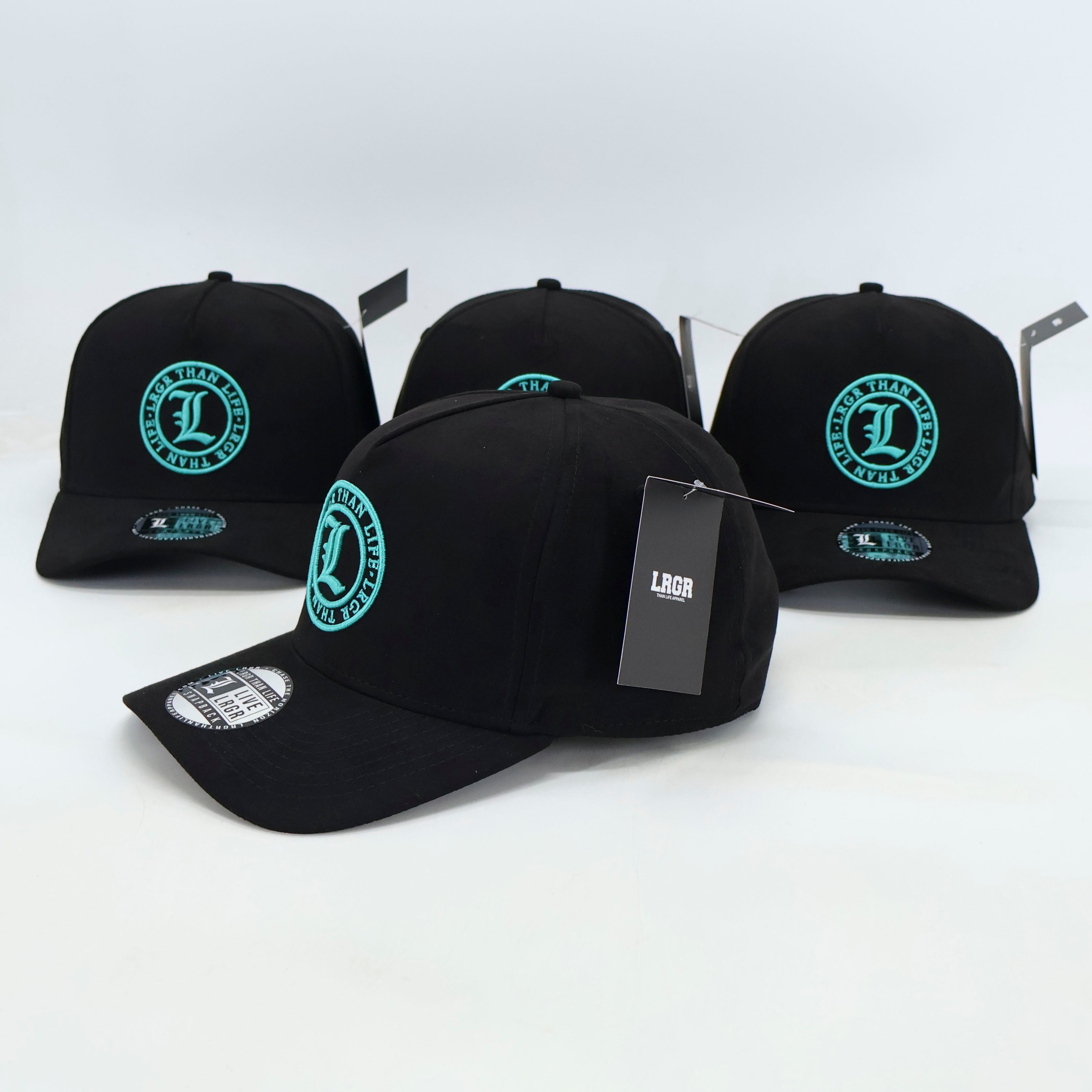 Four black baseball caps with a green logo on a white background