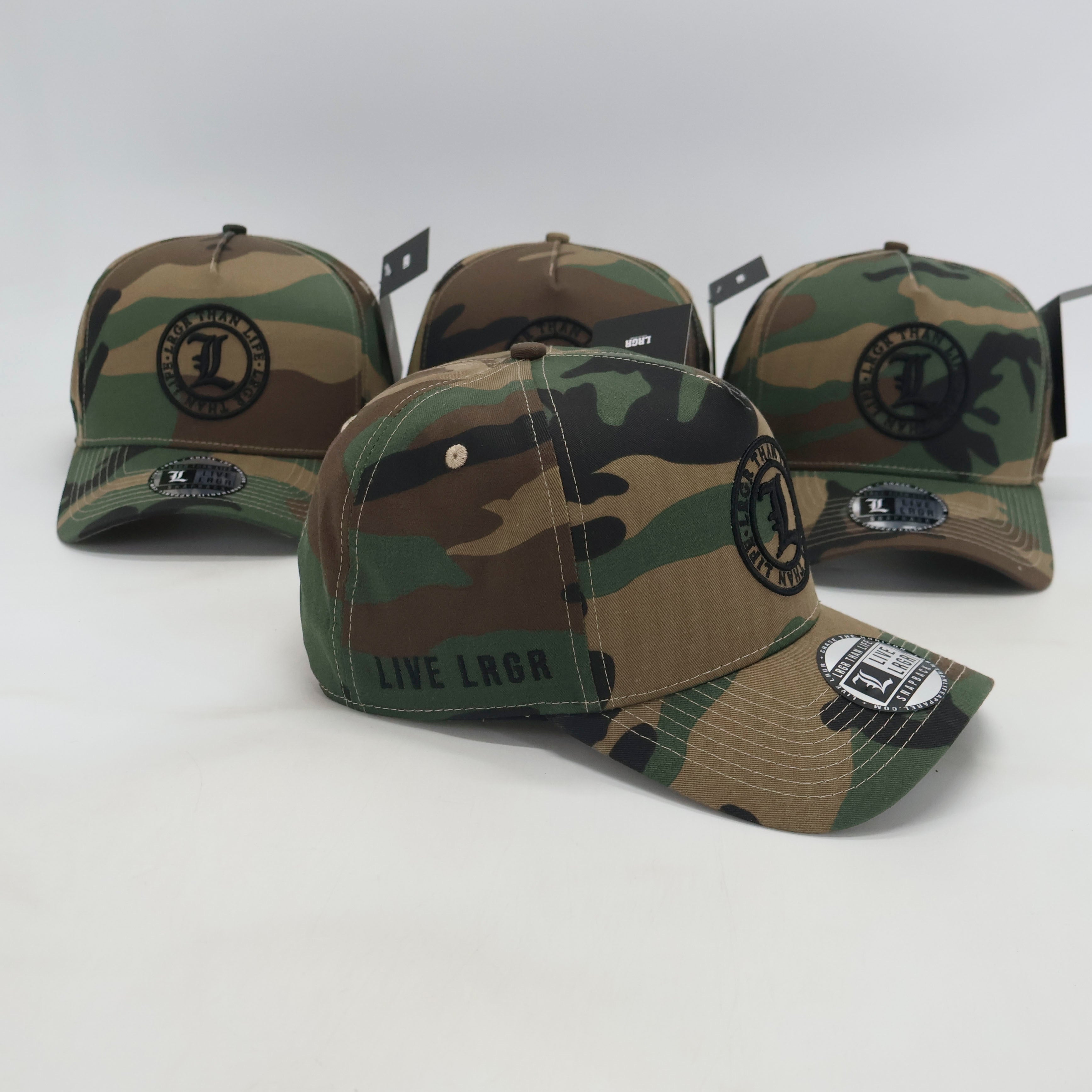 Four camouflage baseball caps with brand logos on a white background