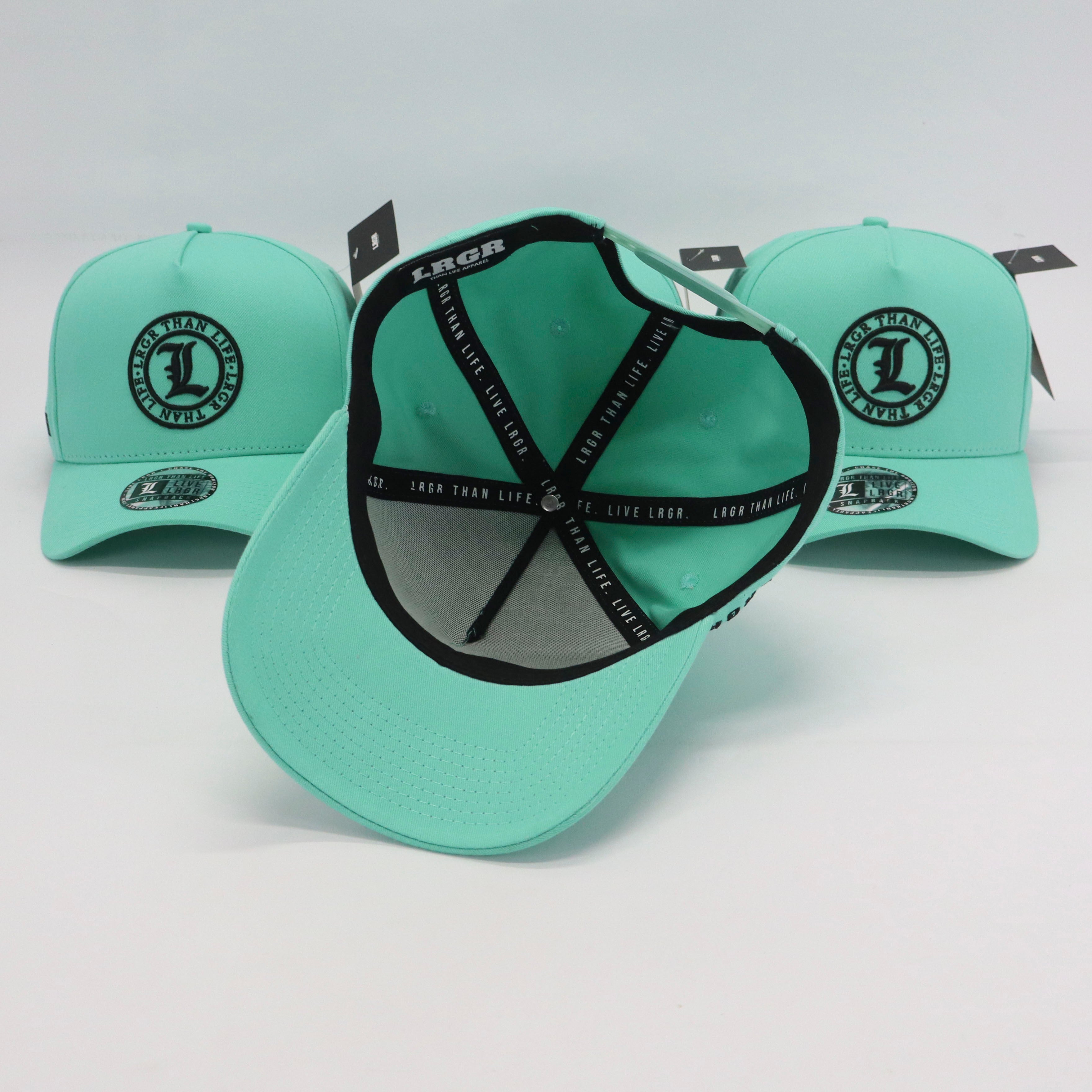 Light blue baseball caps with black branding on a light gray background