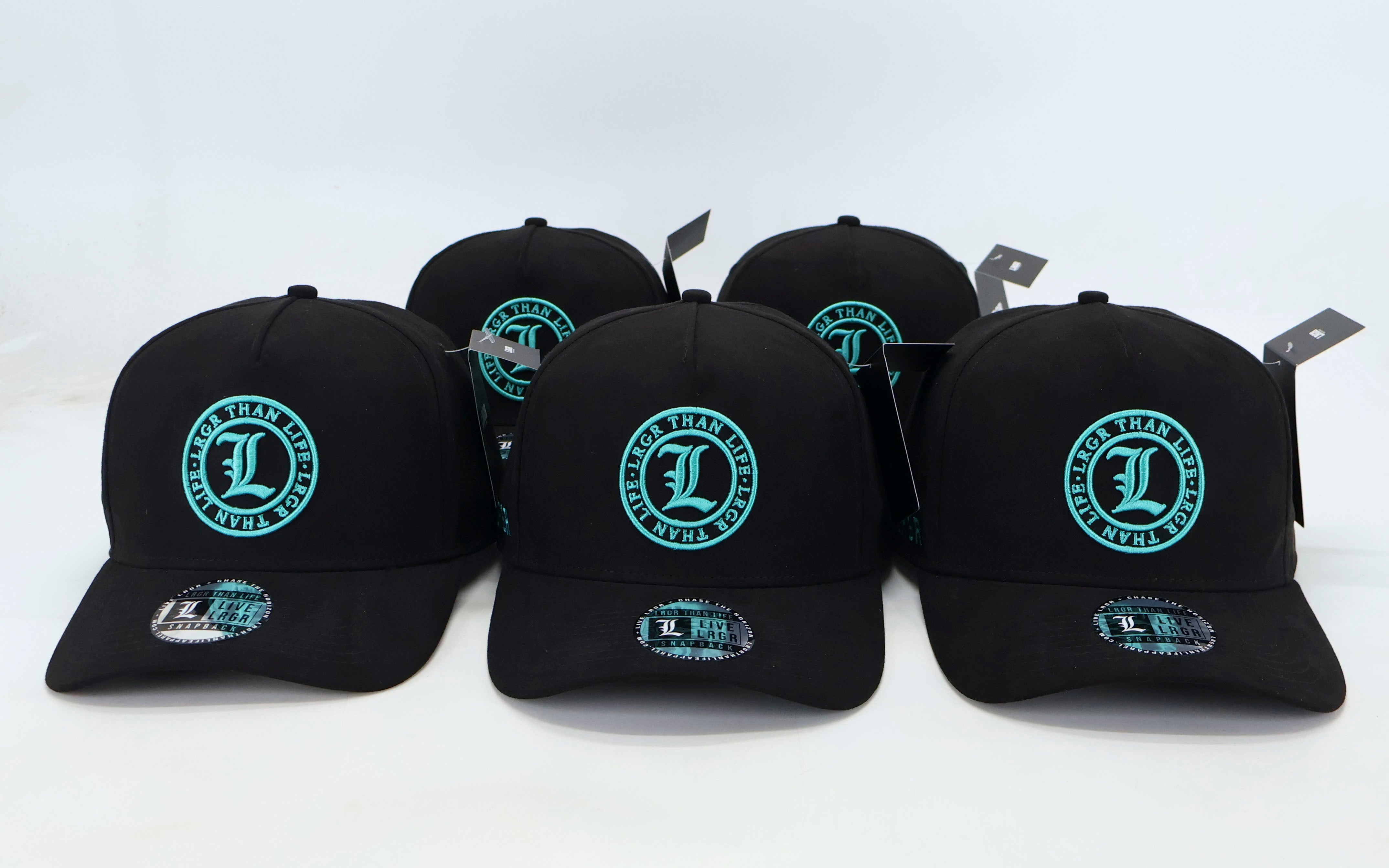 Five black baseball caps with a green logo on a white background