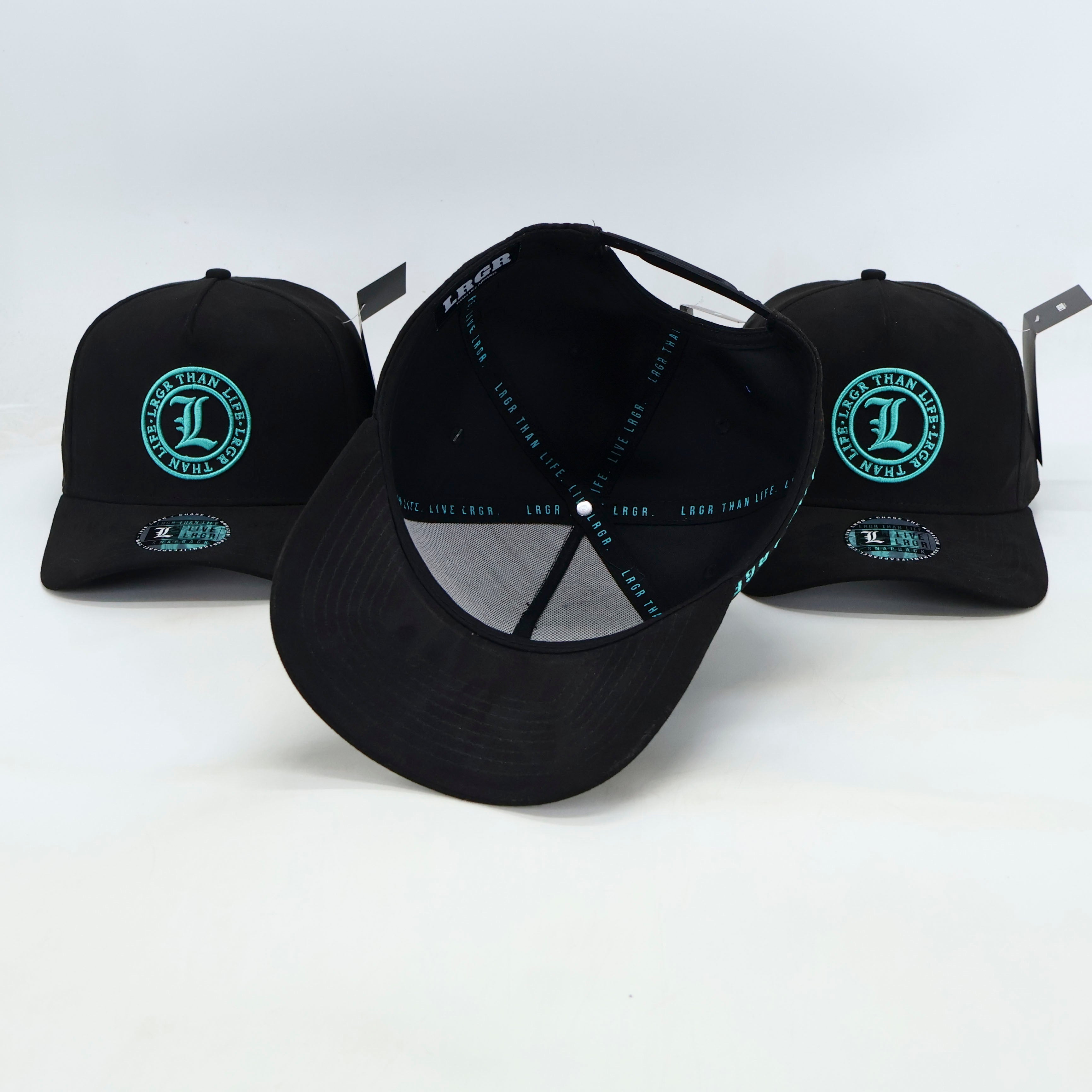 Black baseball caps with green logos on a white background