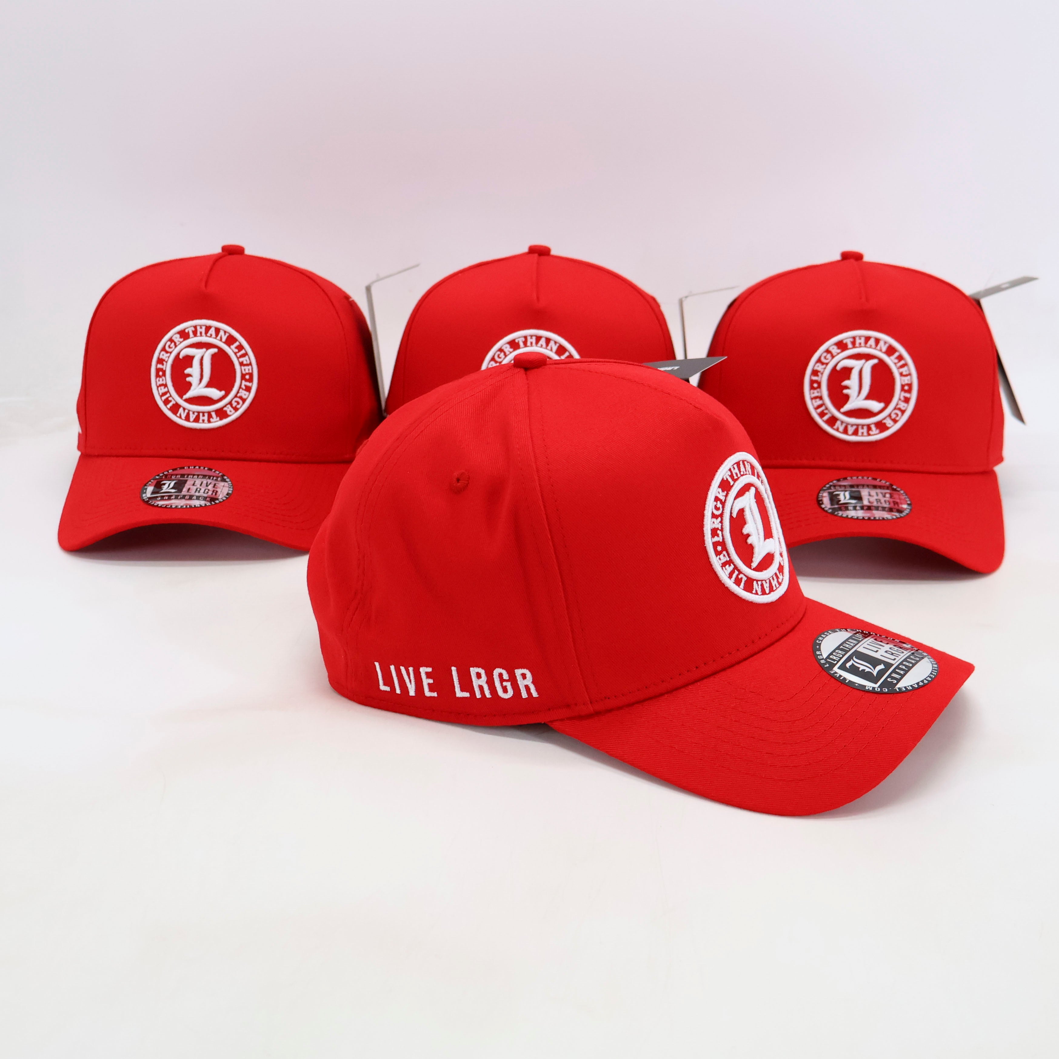 Red baseball caps with logos on a white background