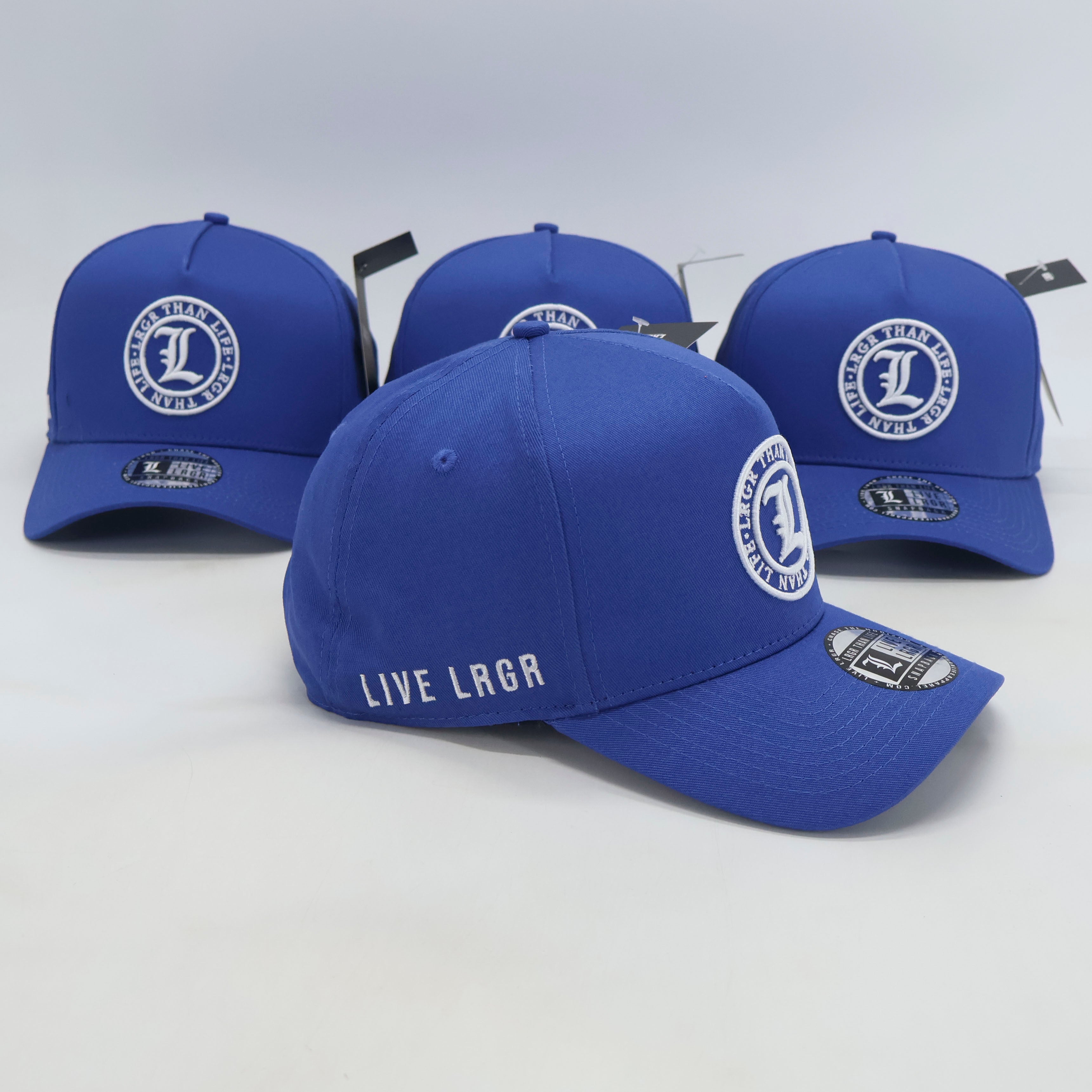 Blue baseball caps with branding on a white background