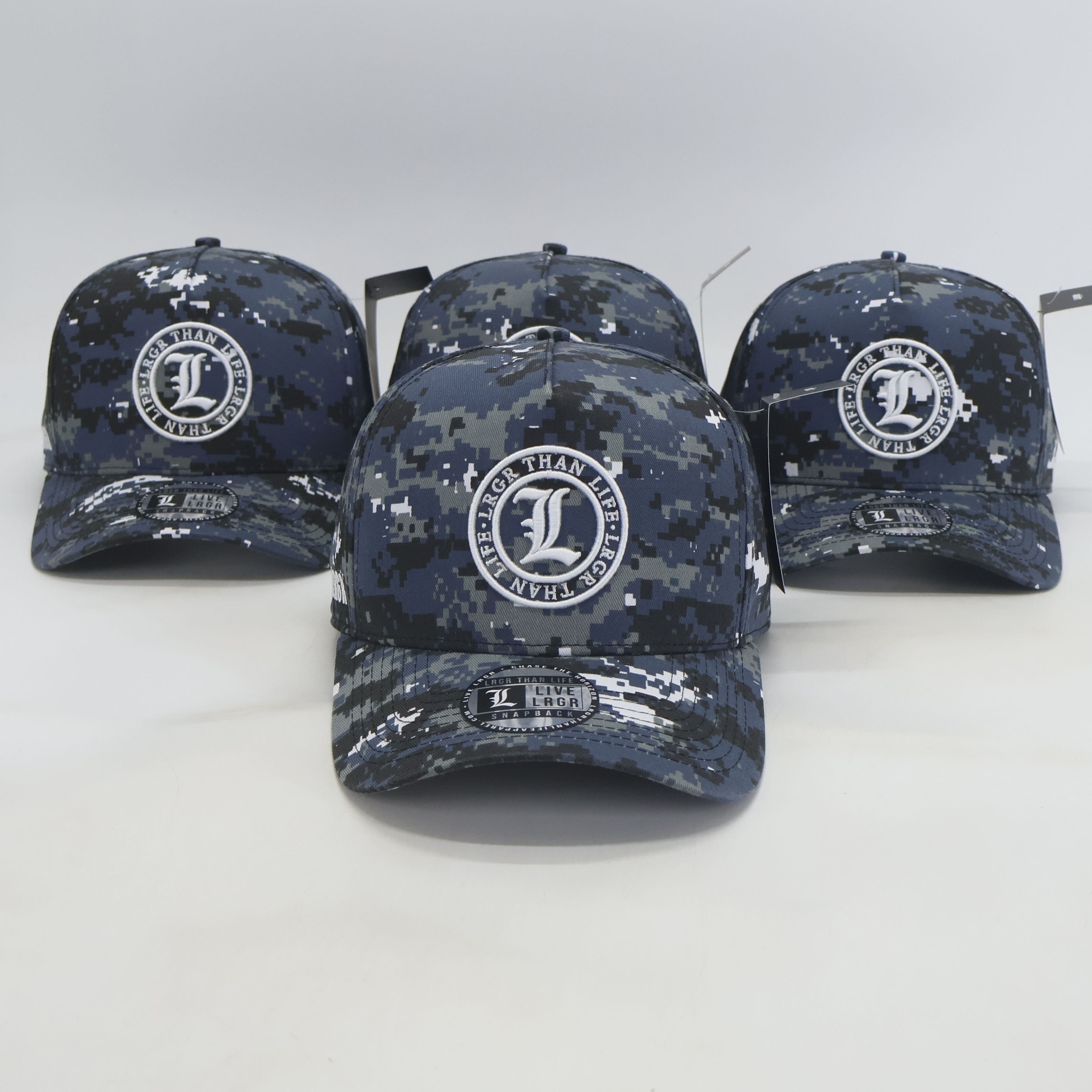 Three navy blue camouflage baseball caps with a logo on a white background