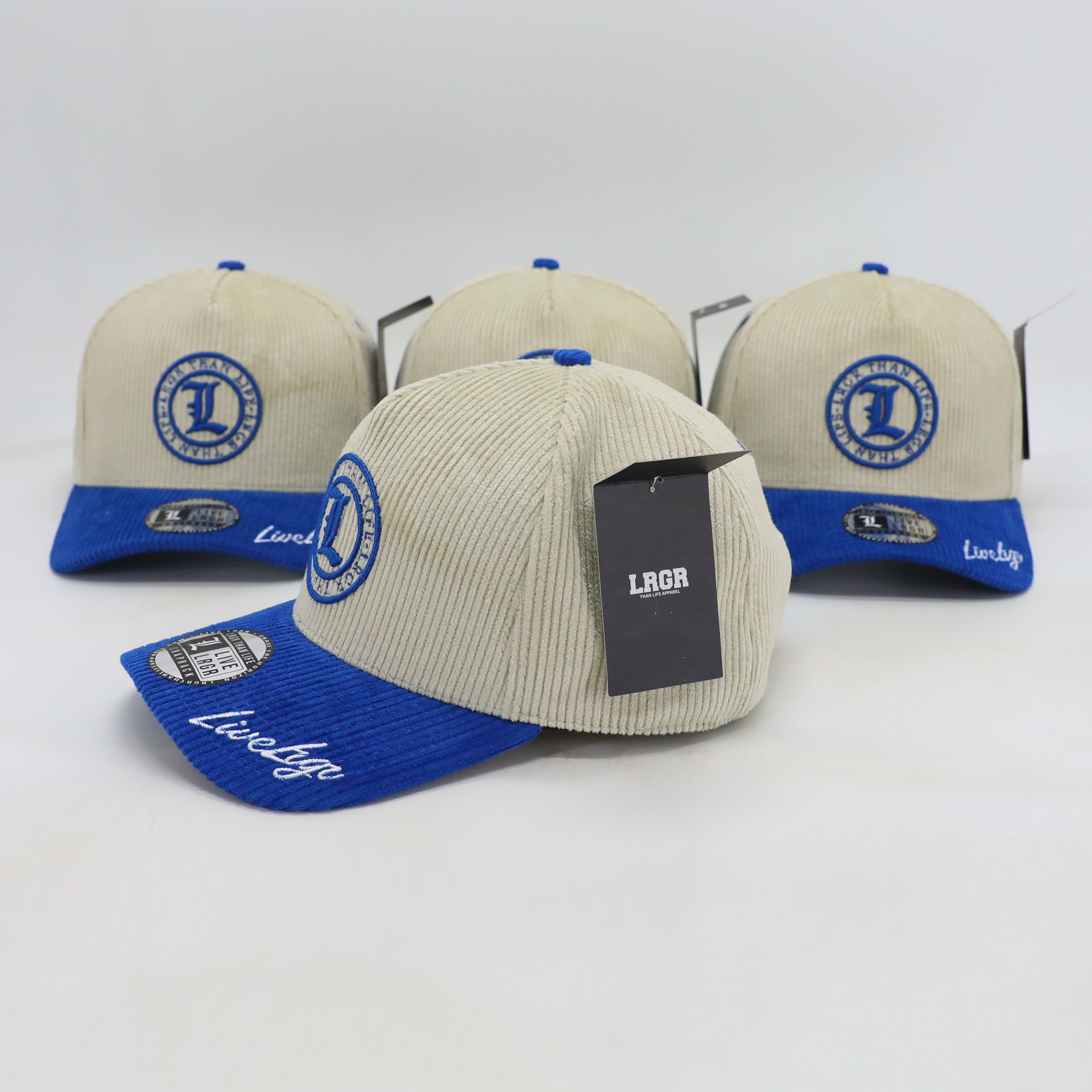 Three caps with blue and beige design, featuring a logo and text on a white background.