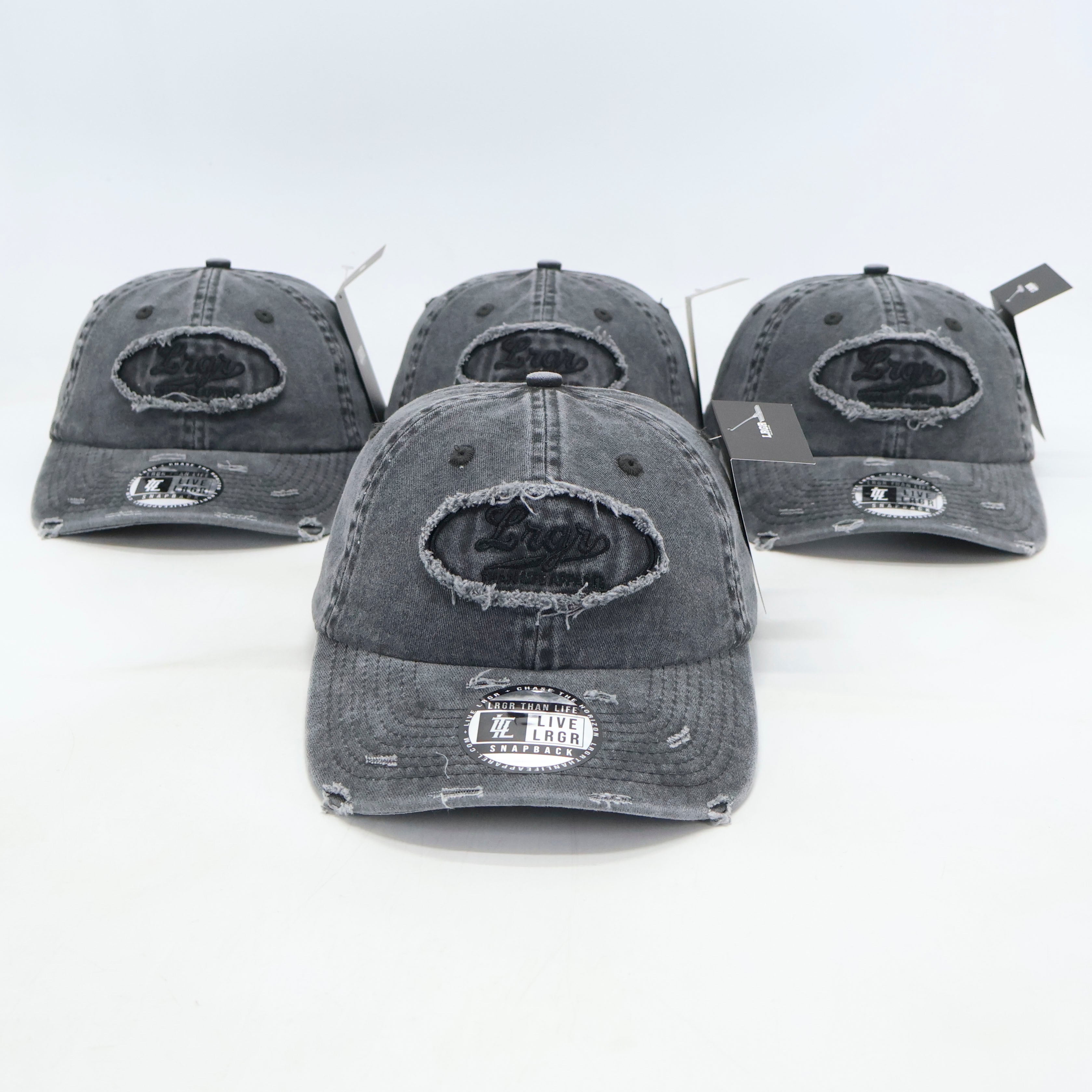 A set of grey dad hats with a 3D embroidery patch on the front displayed against a white background.
