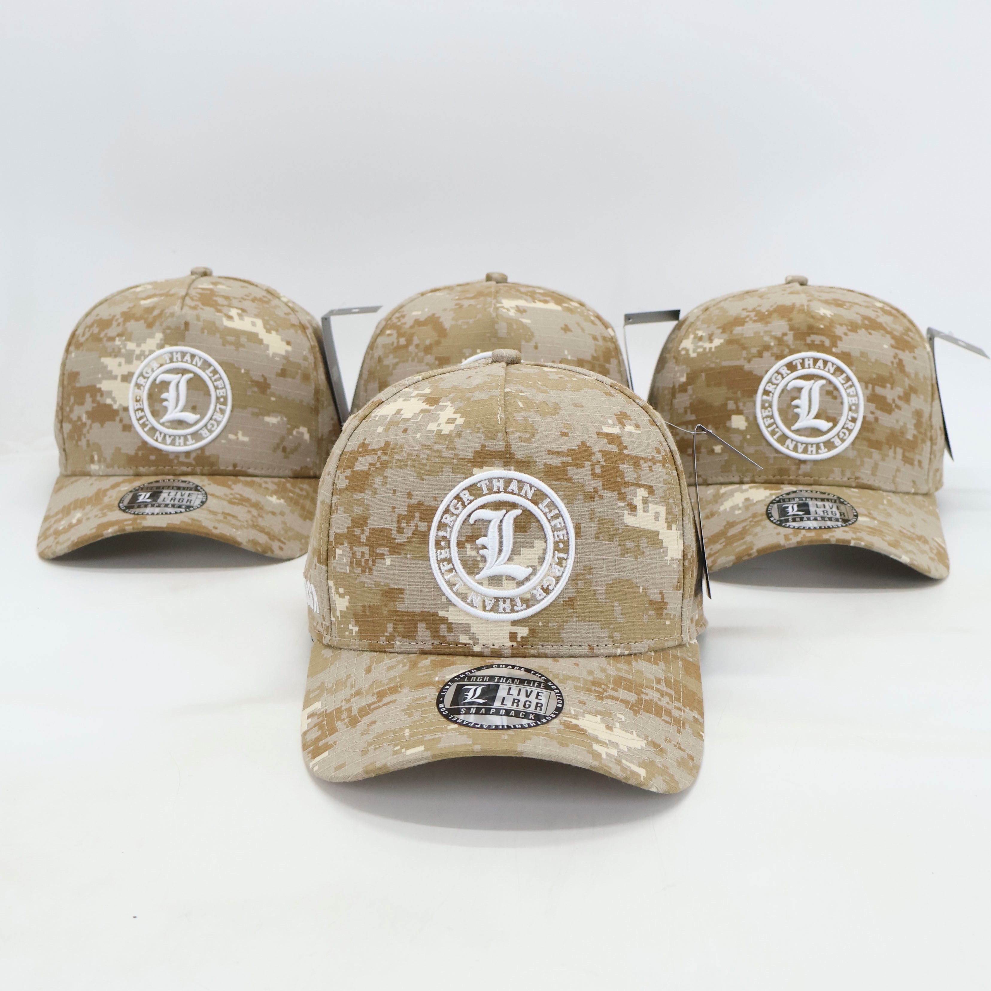 Four camouflage baseball caps with logos on a white background