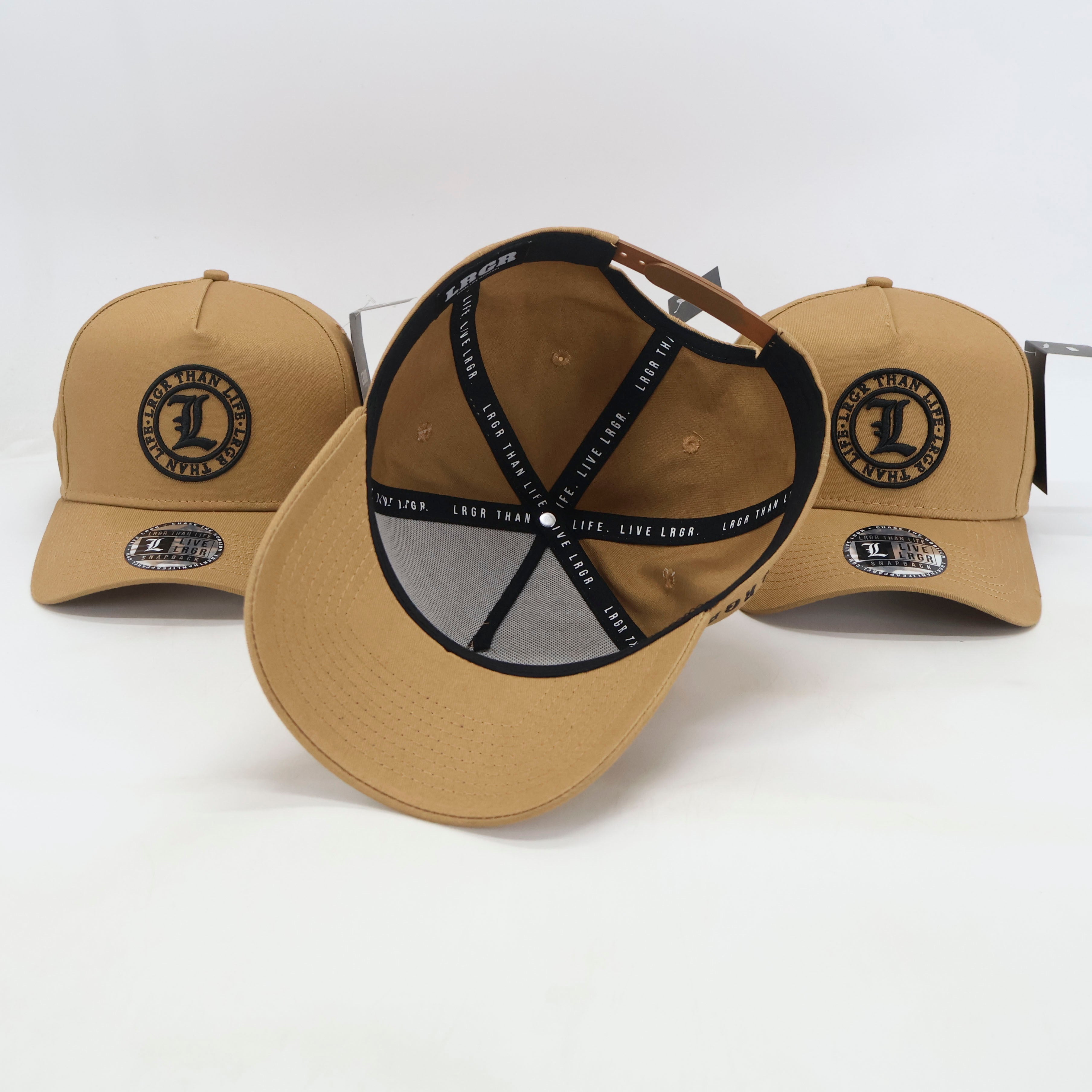 Three tan baseball caps with a central cap showing the front and back design on a white background.