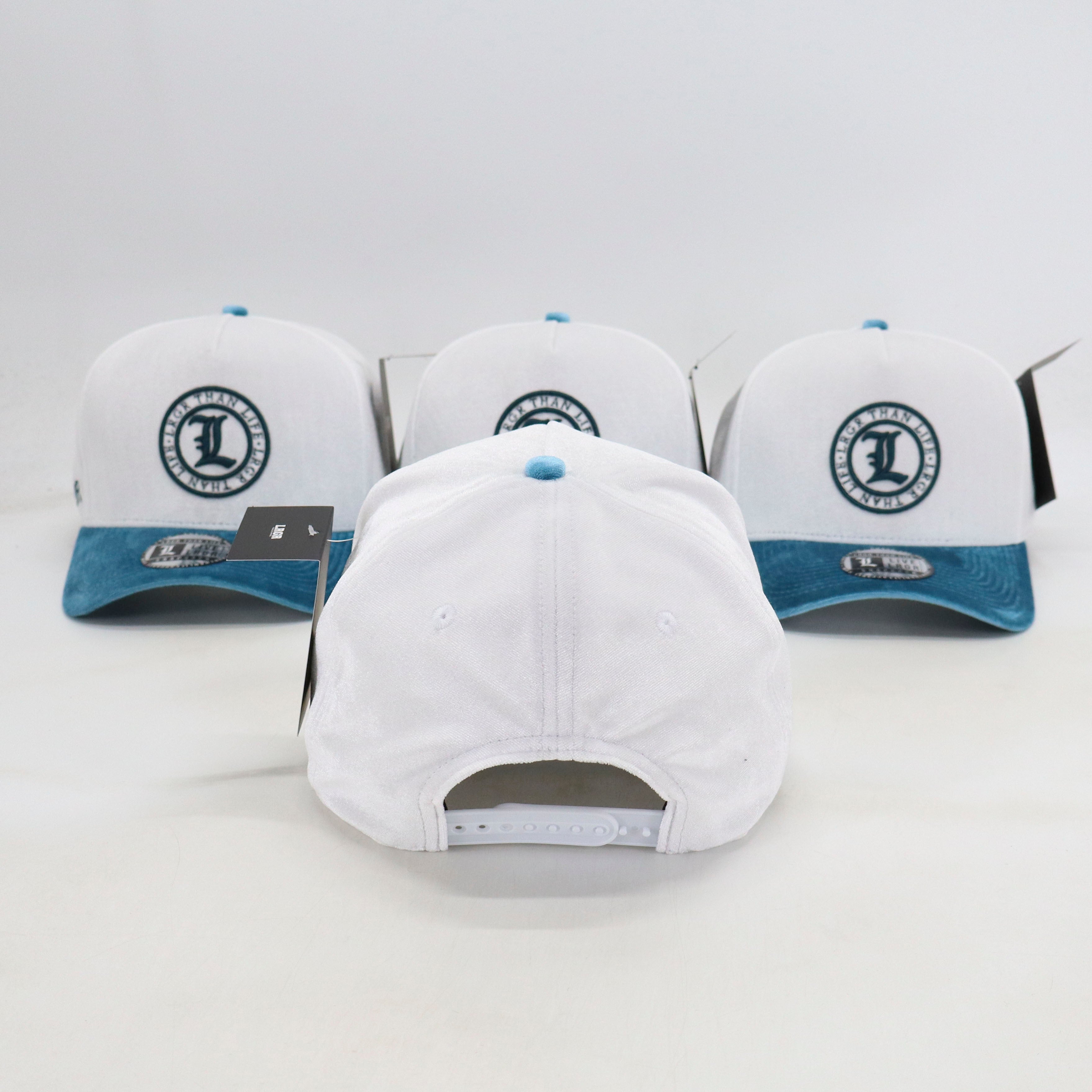 Three white baseball caps with blue accents and a logo on a light gray background
