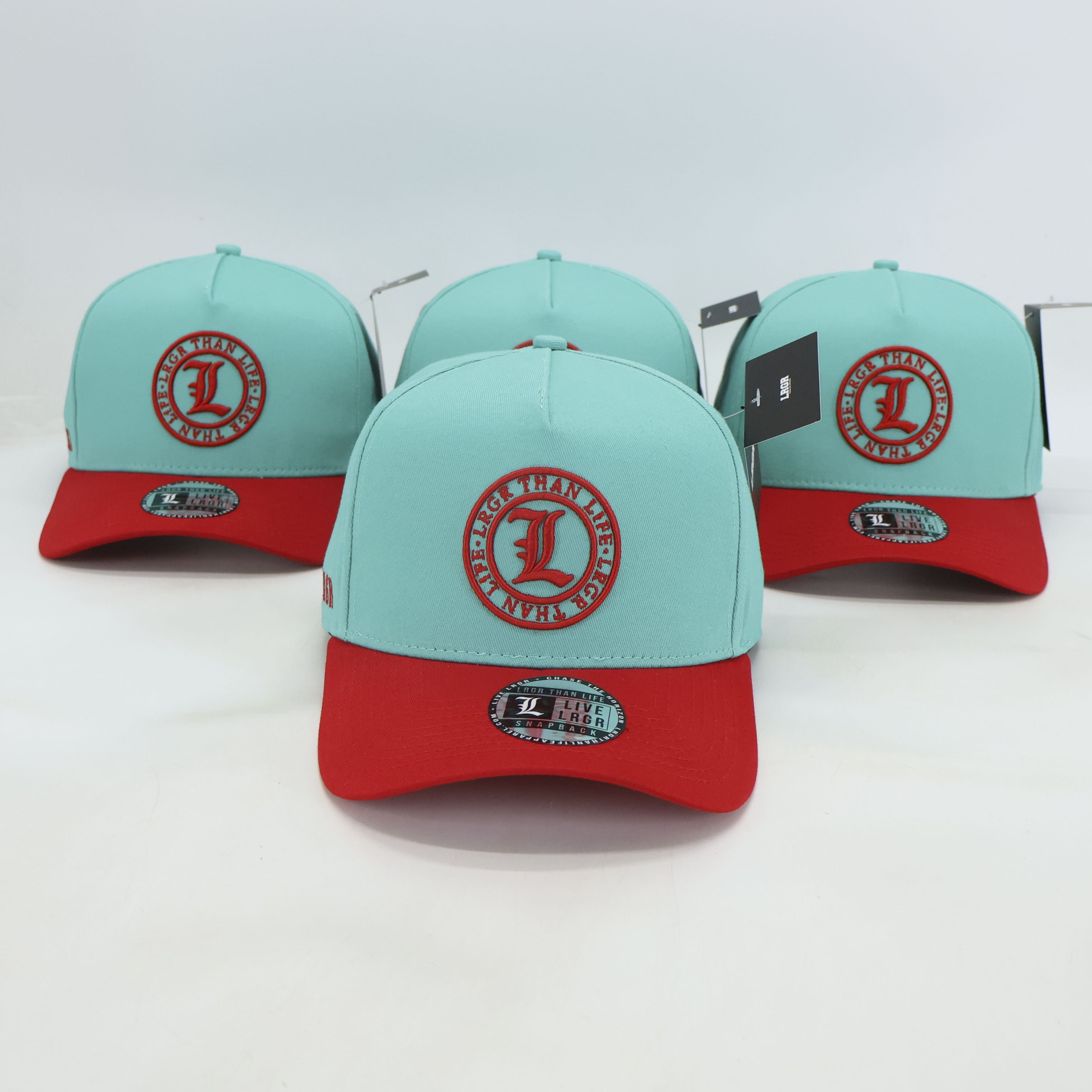 Three light blue and red caps with a logo on a white background
