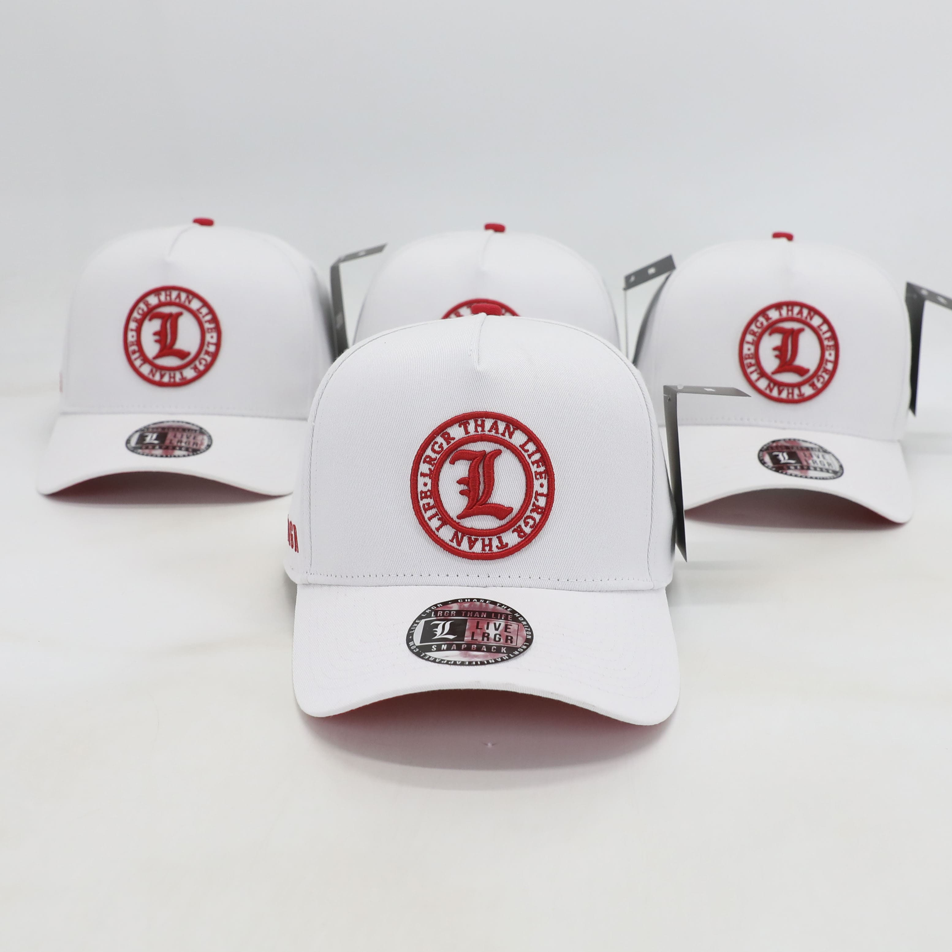 White baseball caps with red logos on a white background