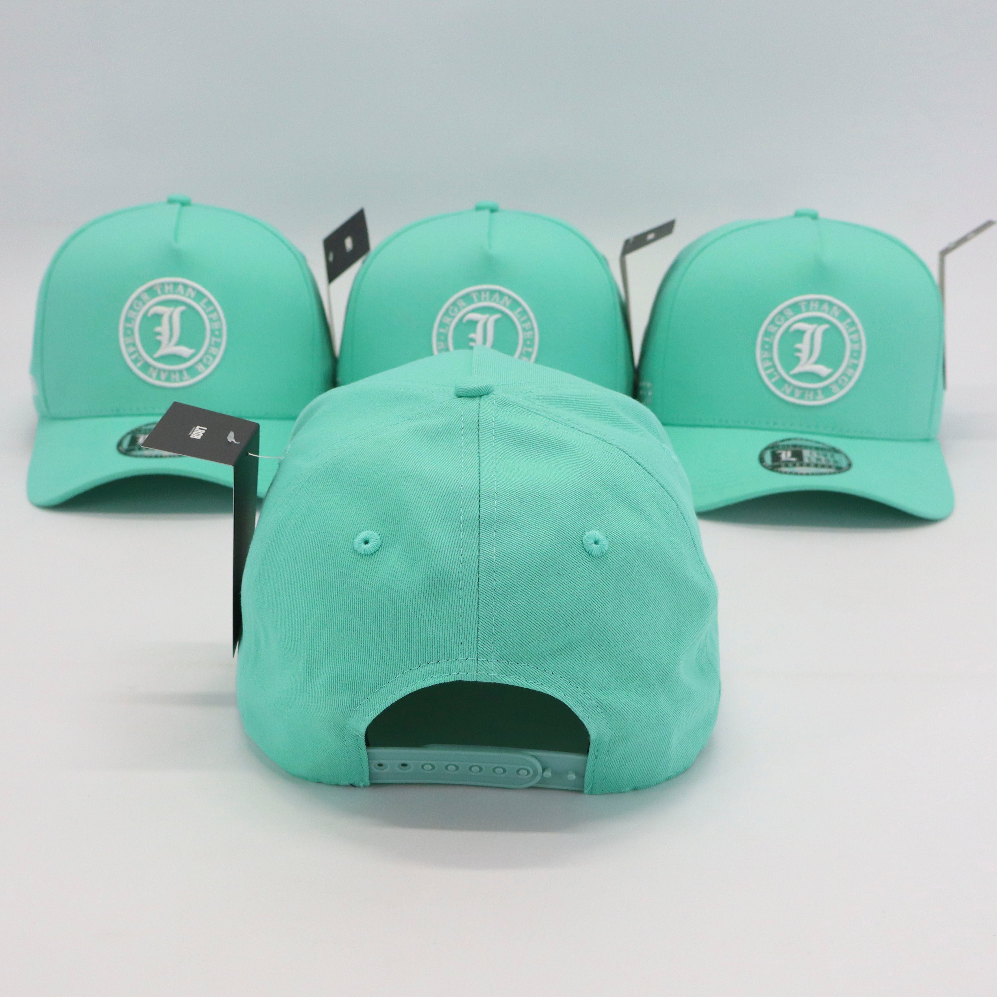 Three green caps with a logo on a light gray background