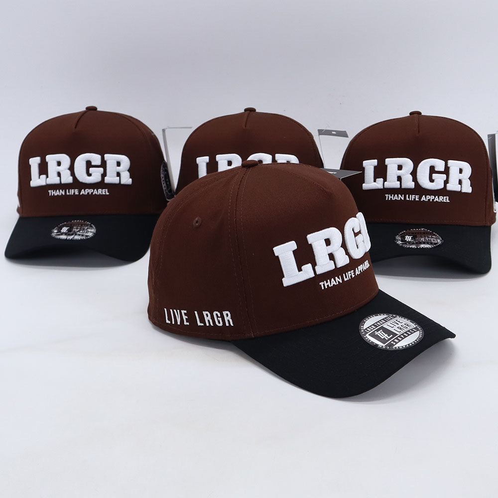 A collection of brown A-frame hats with 'LRGR' and 'THAN LIFE APPAREL' text embroidered on the front.
