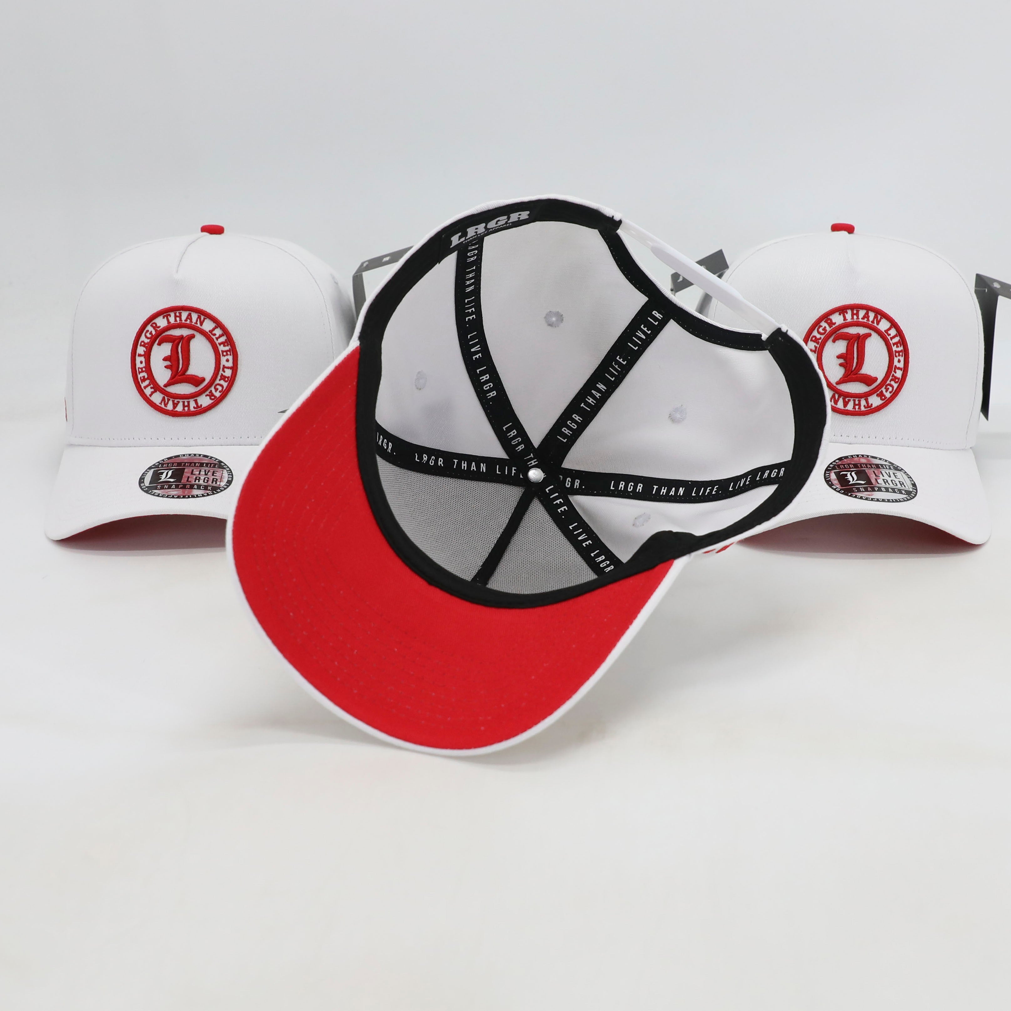 Red and white cap with black logo on a light gray background