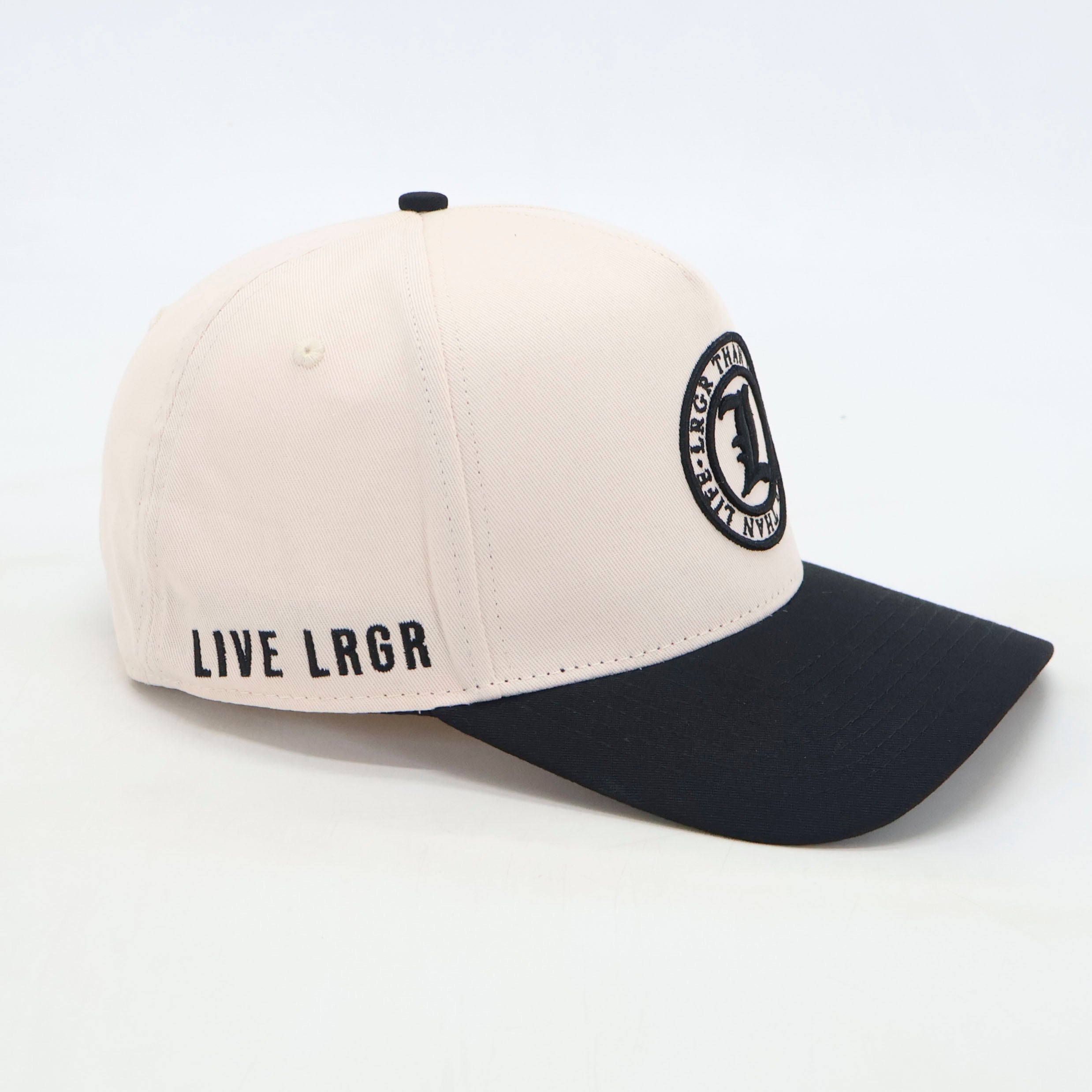 Two-tone cap with black and white design on a light gray background