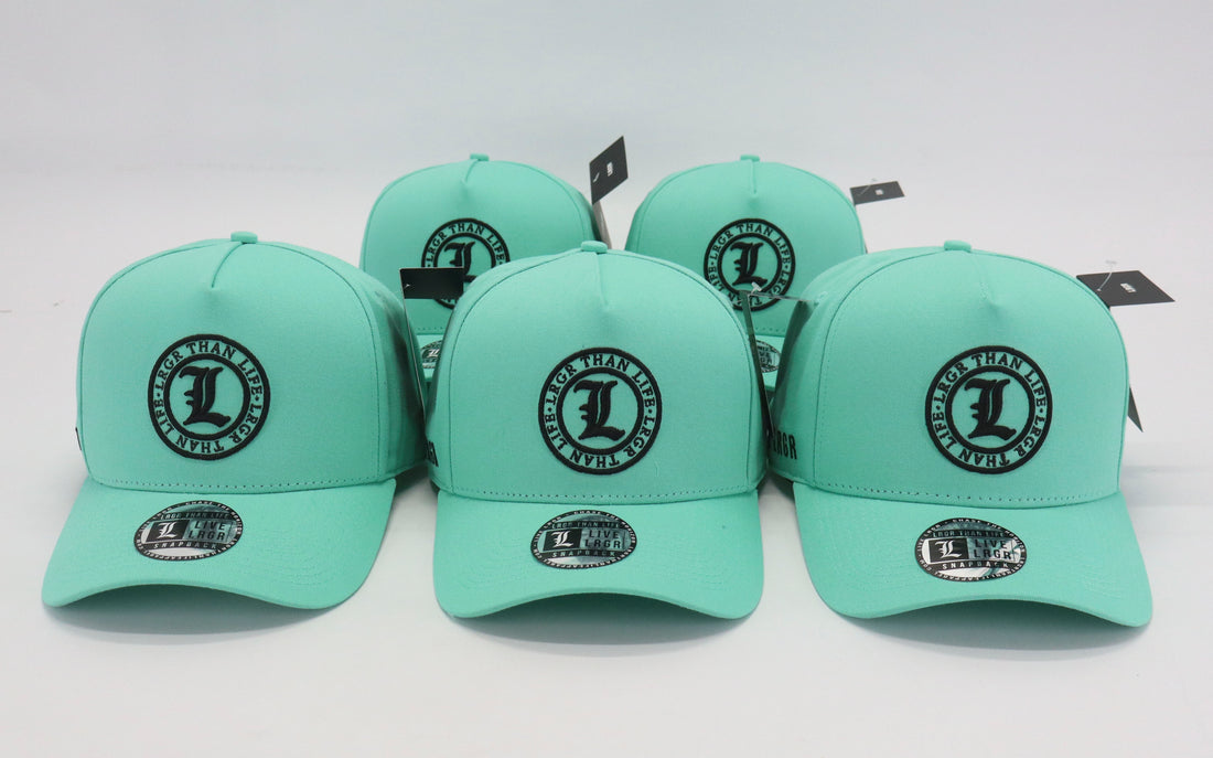Set of light green caps with a logo on a white background