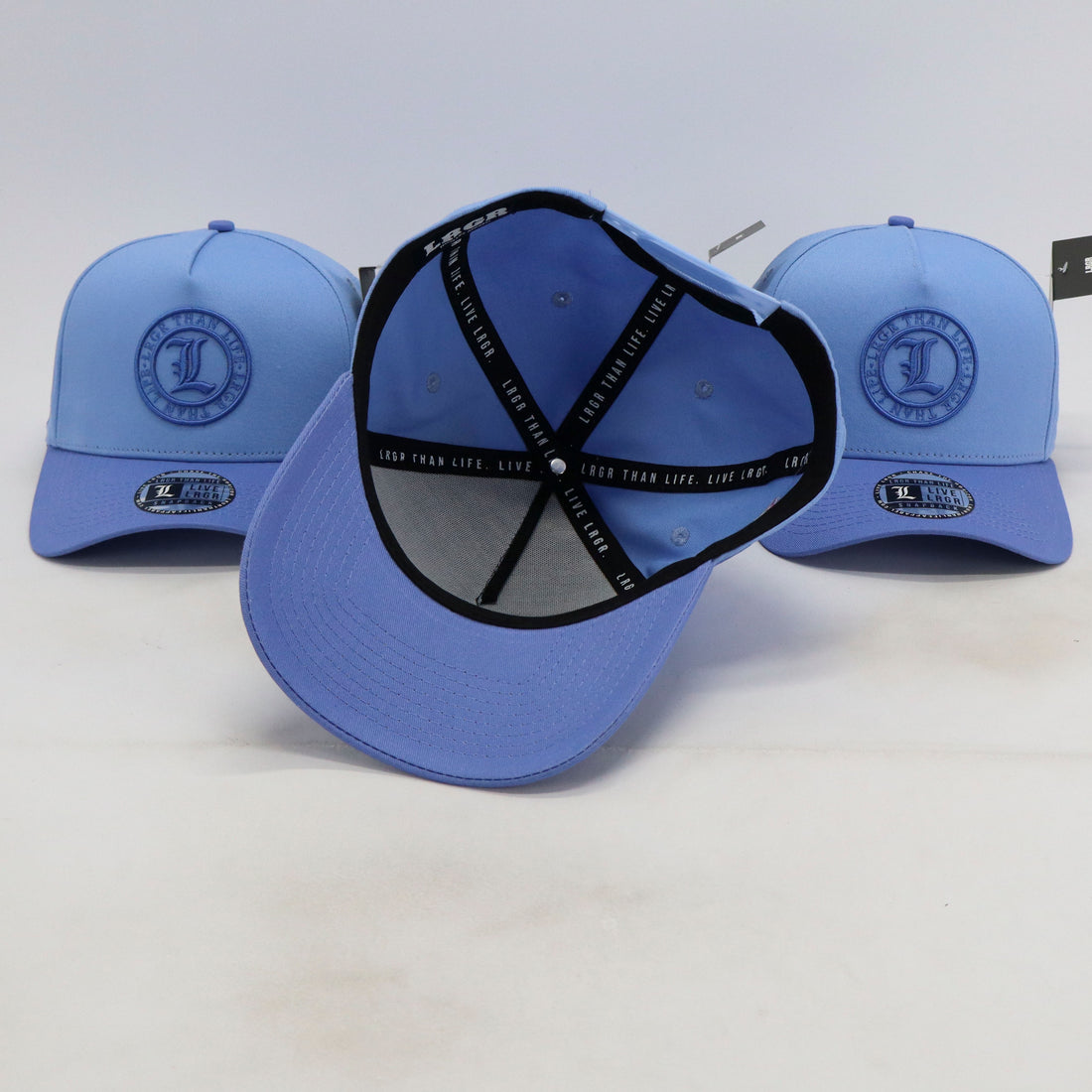 Blue baseball cap with a logo on a white background