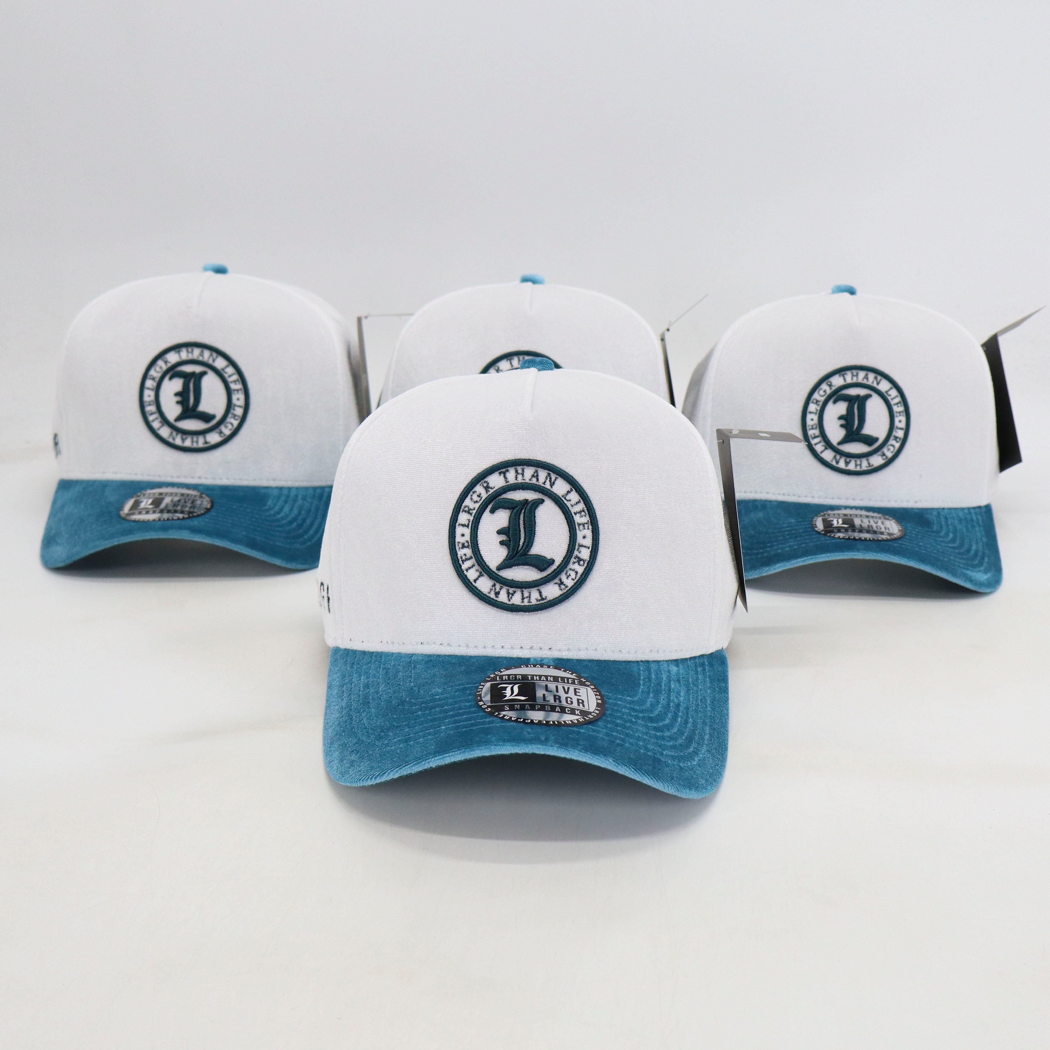 Three white and blue caps with a logo on a light gray background