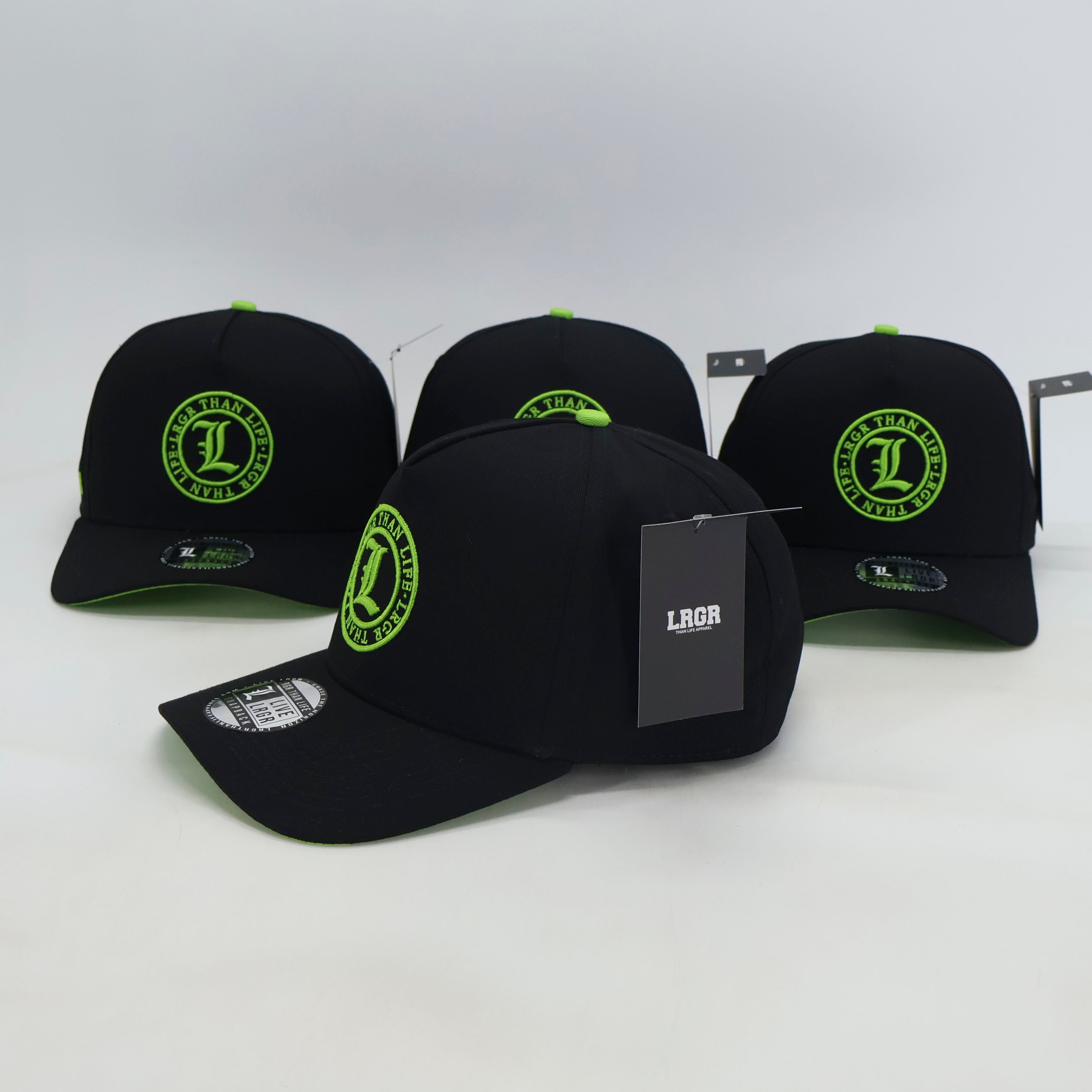 Black baseball caps with green logos on a white background
