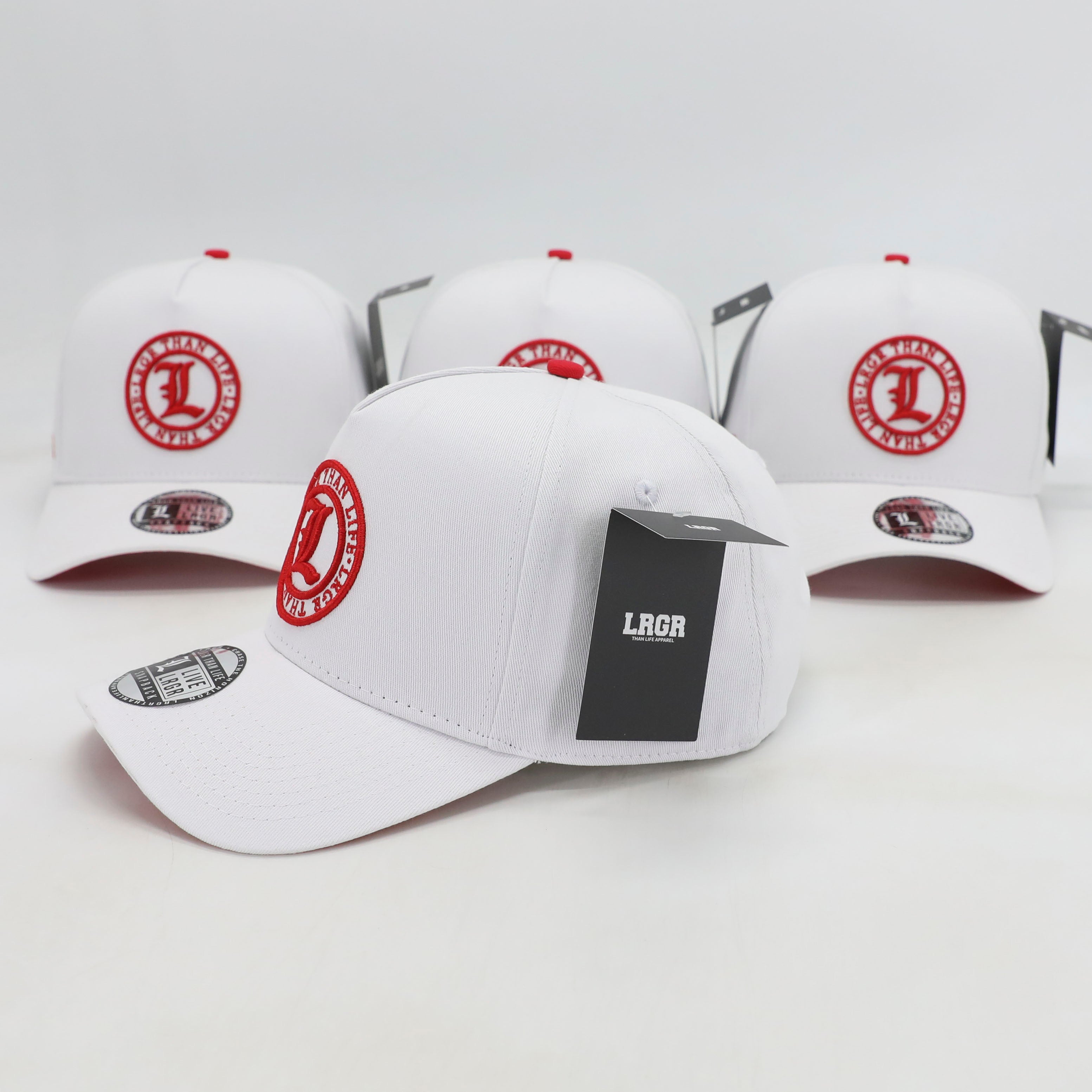 White baseball caps with red logos on a white background