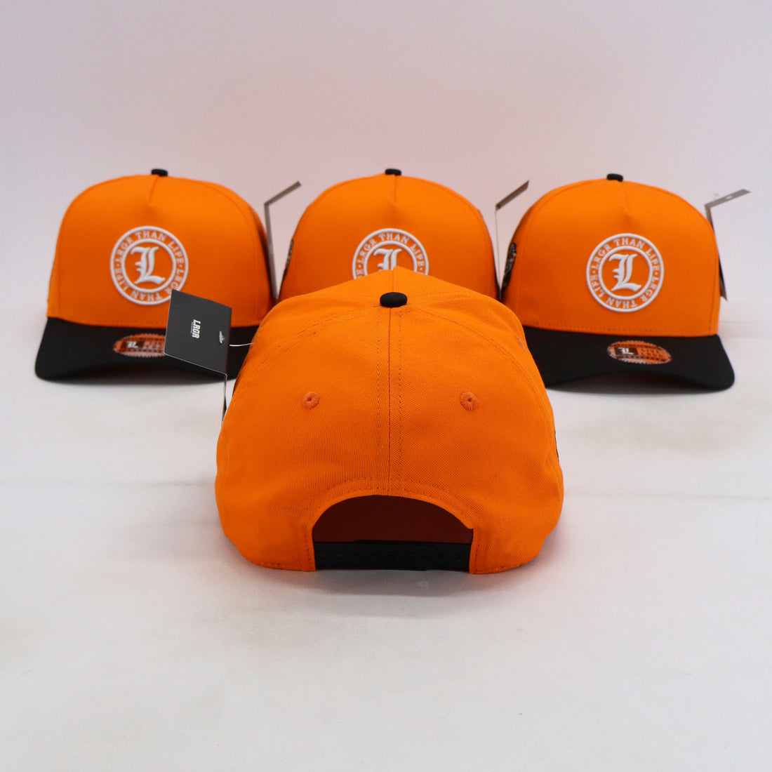 Orange and black caps with a logo on a white background