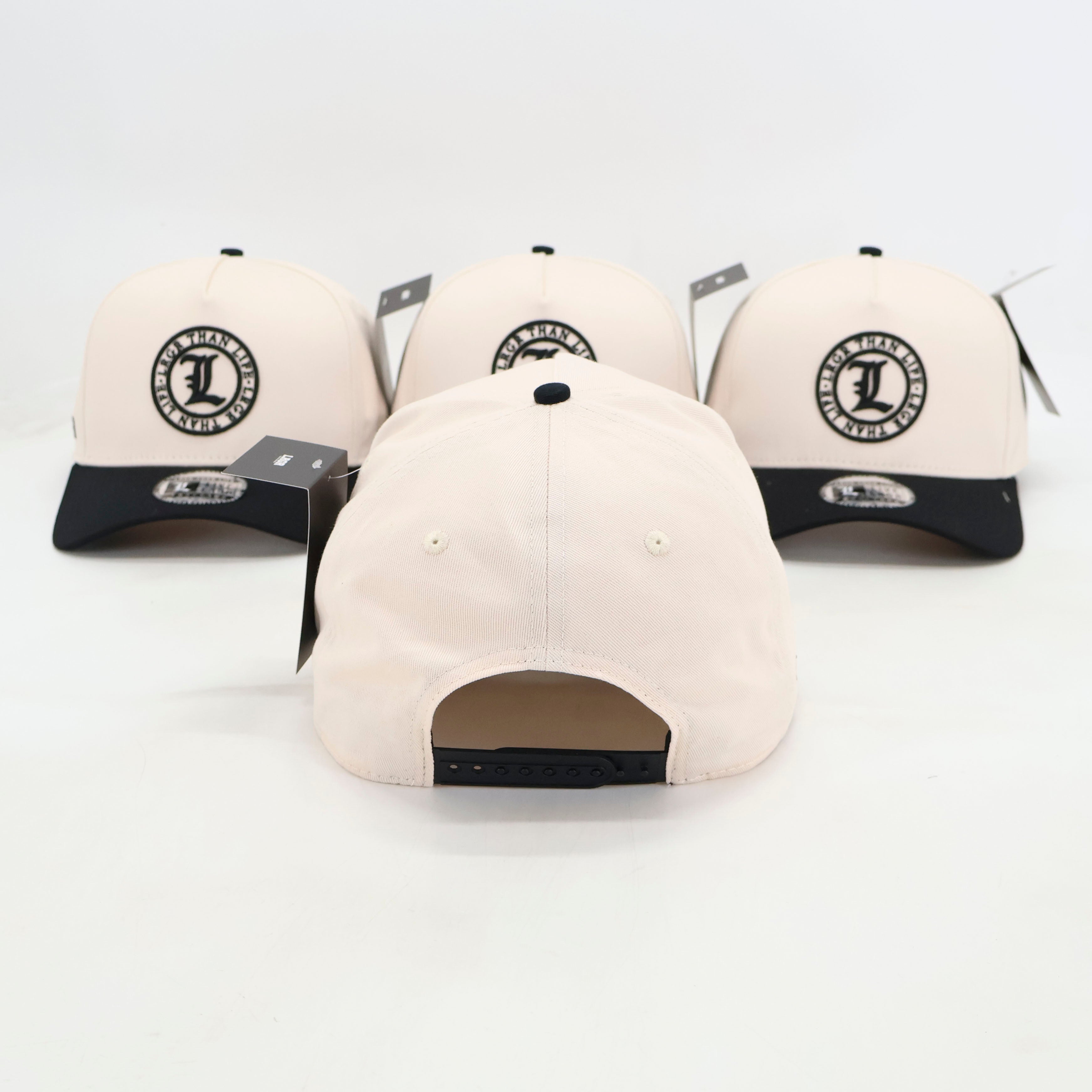 Four beige baseball caps with black brims and logos on a white background