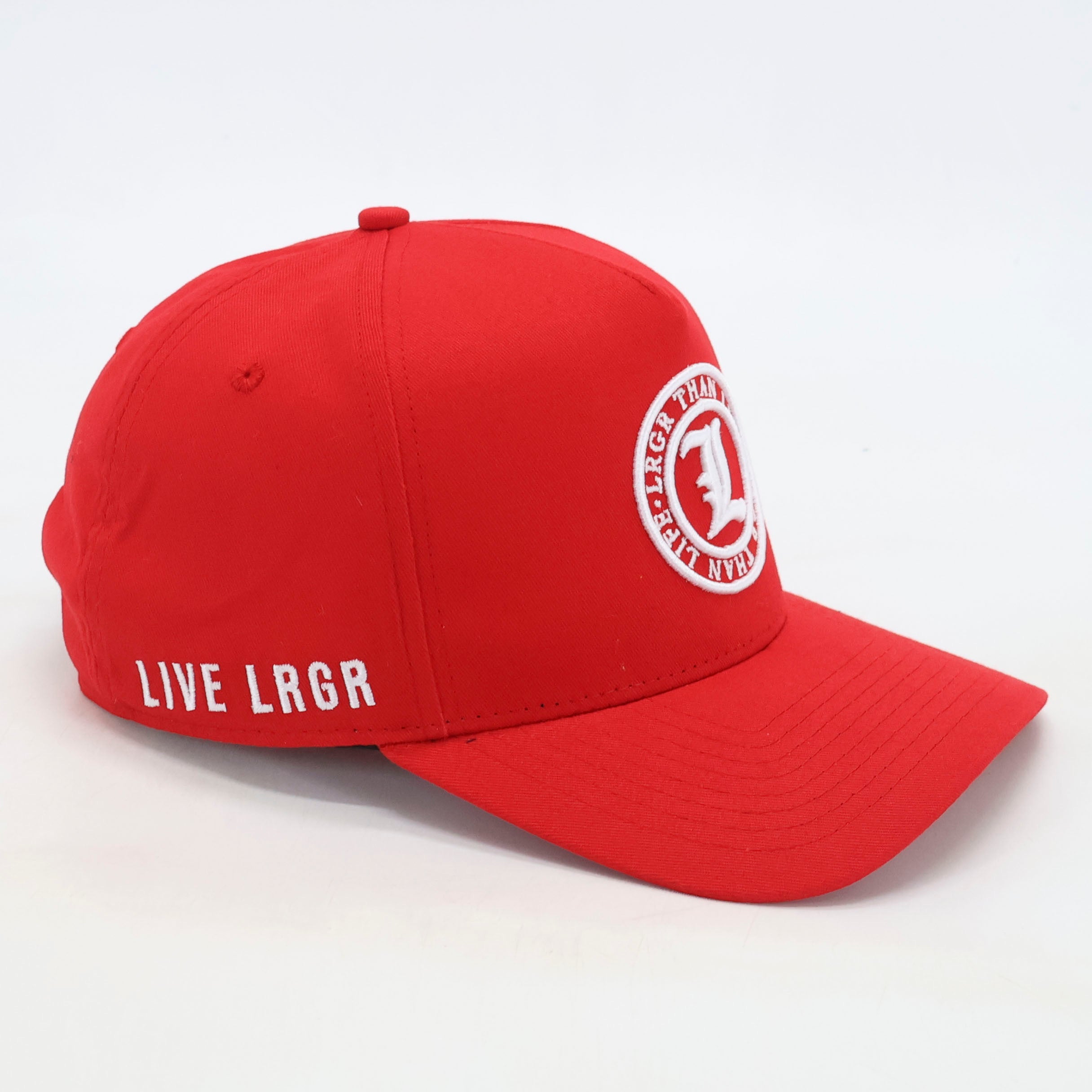 Red cap with white logo and text on a light gray background