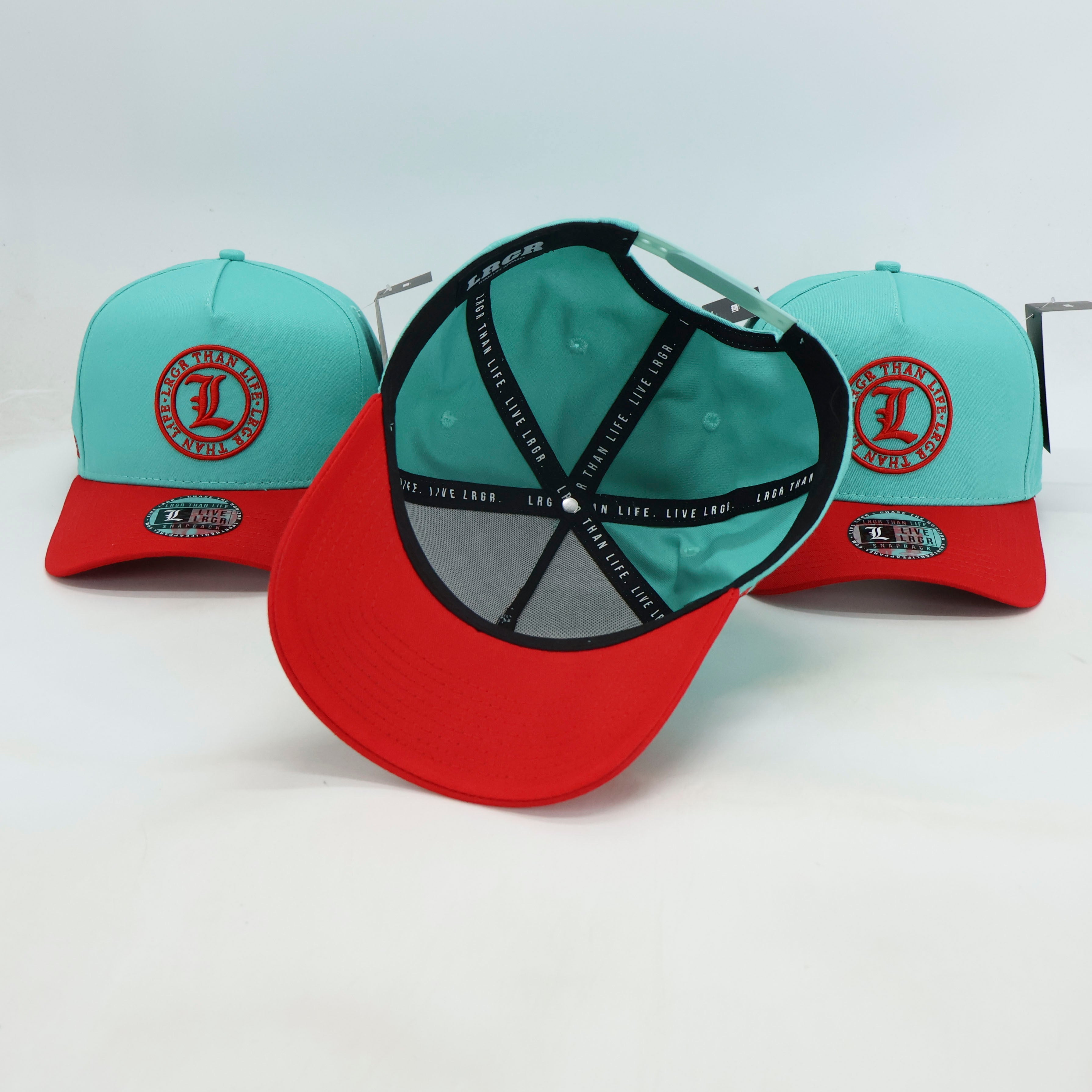 Two caps with a red and light blue color scheme on a white background