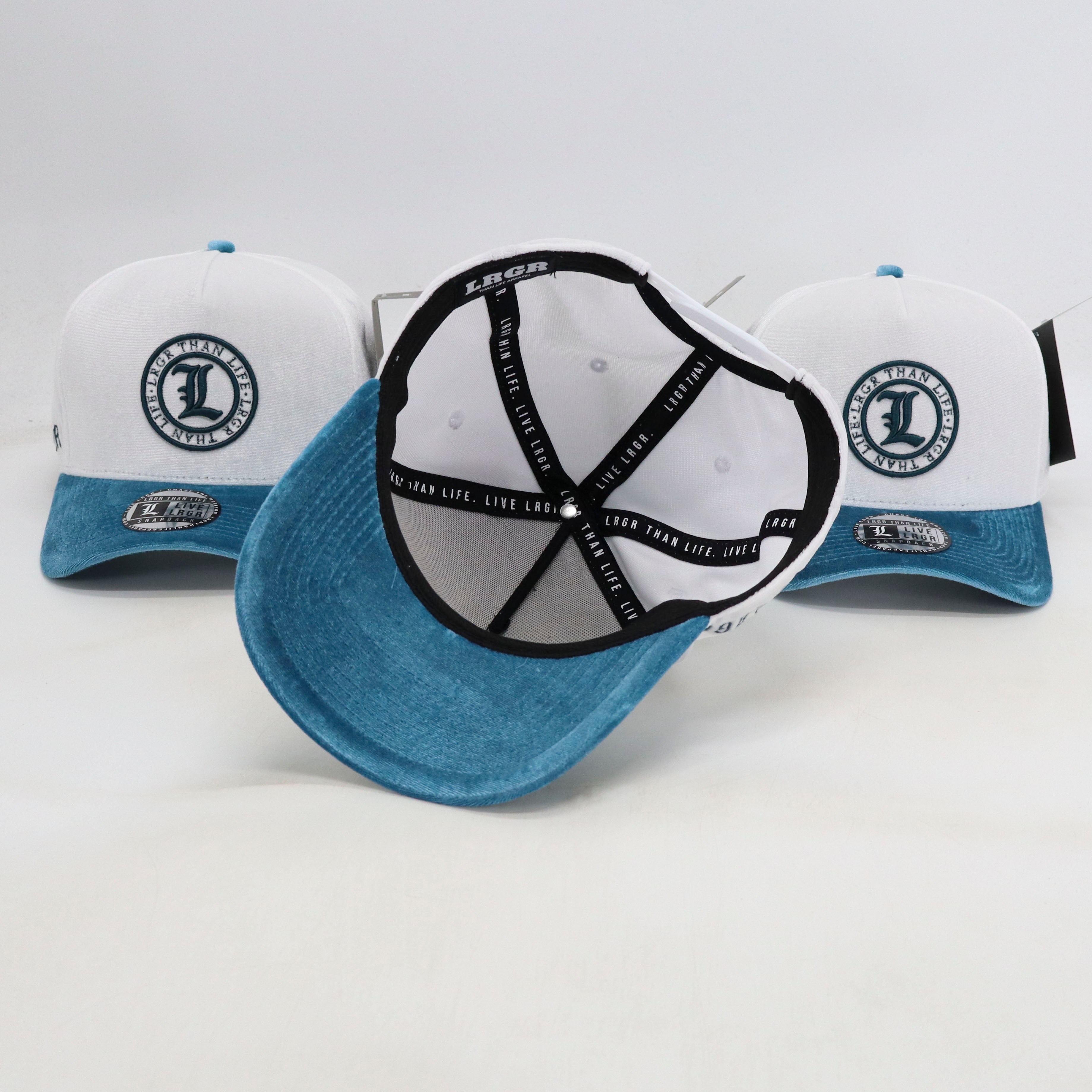 Three blue and white baseball caps with a logo on a light gray background
