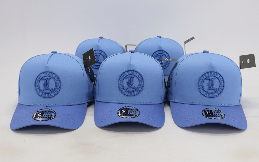 Set of blue caps with logos on a white background