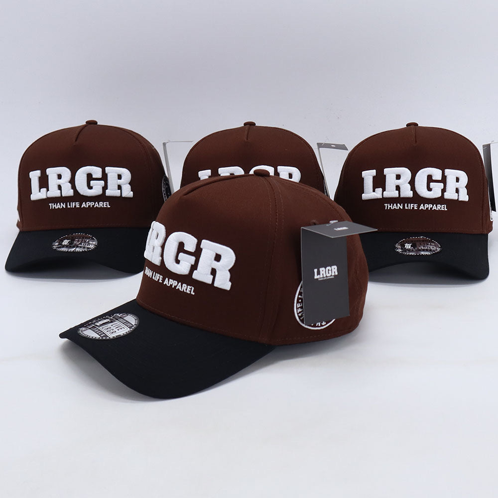 A collection of brown A-frame hats with 'LRGR' and 'THAN LIFE APPAREL' text embroidered on the front.
