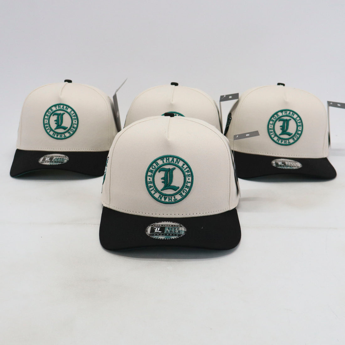 Four baseball caps with a logo on a white background