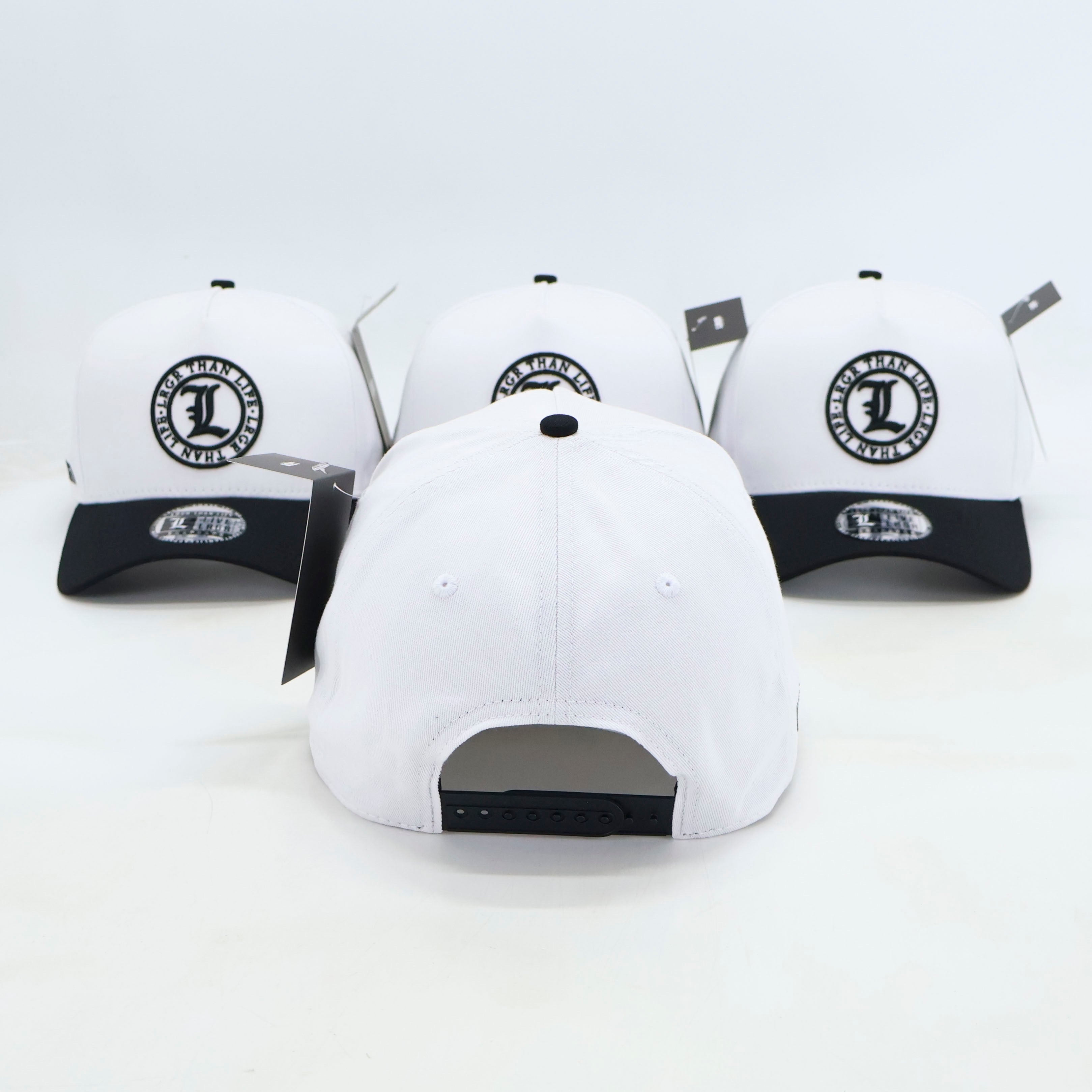 White baseball caps with black logos on a white background