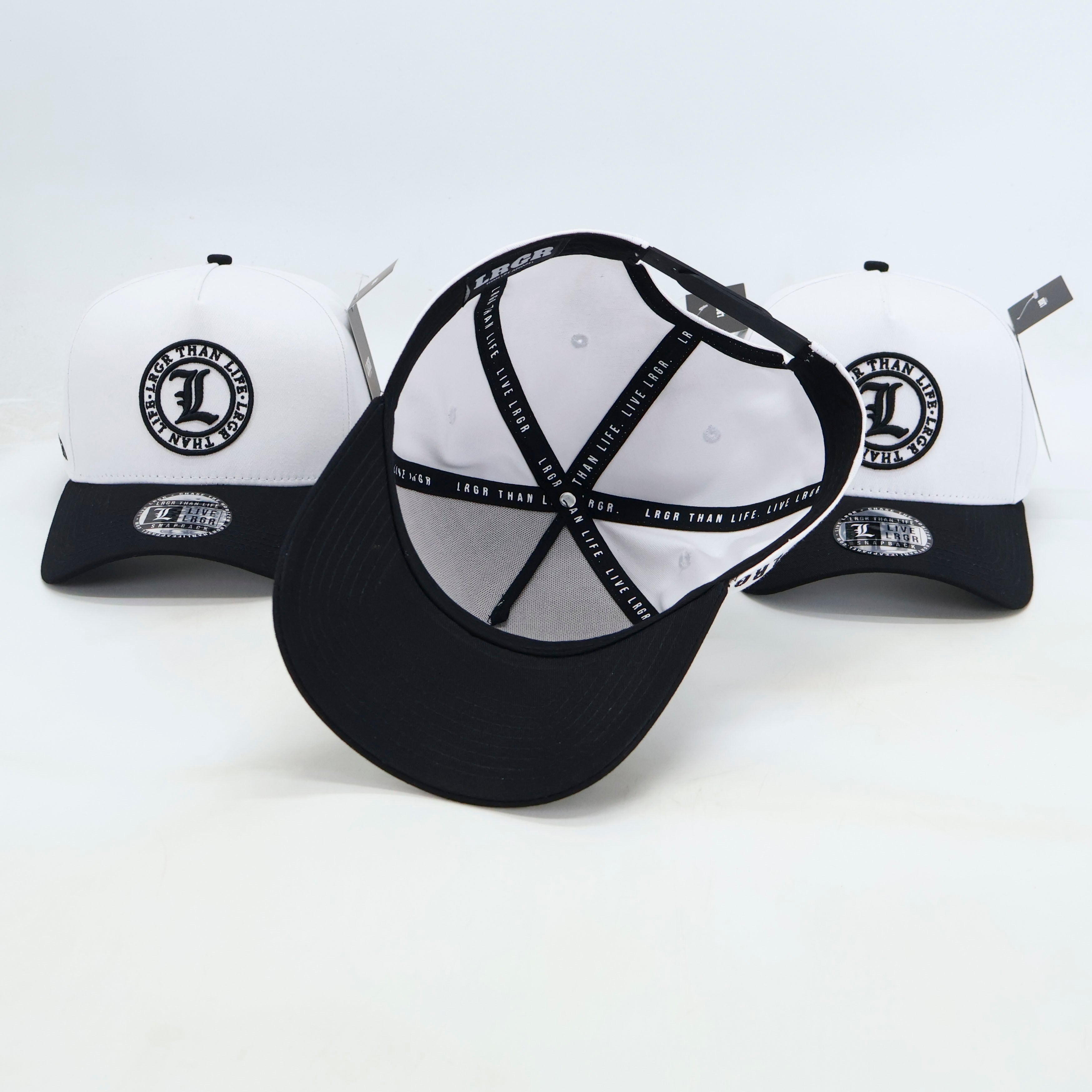 Black and white baseball caps with branding on a white background