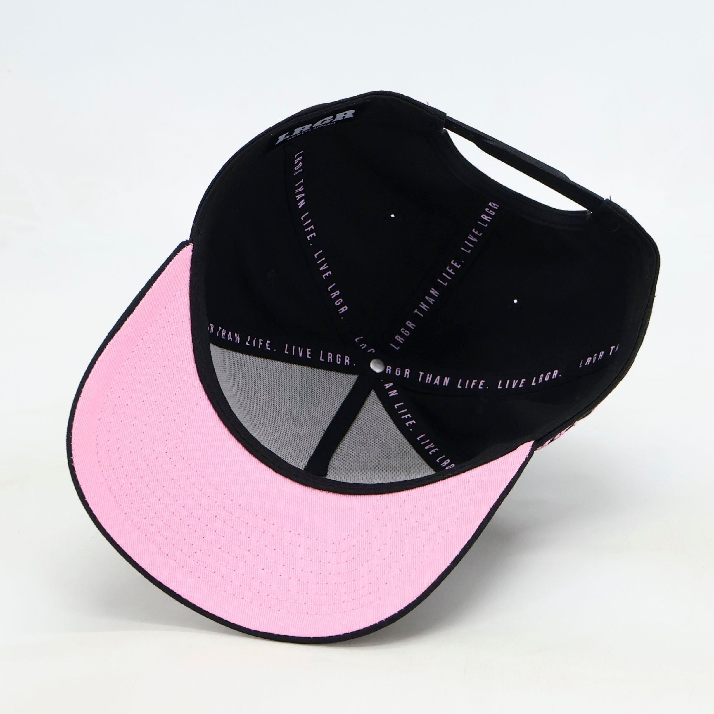 Black, gray, and pink cap with text on a white background