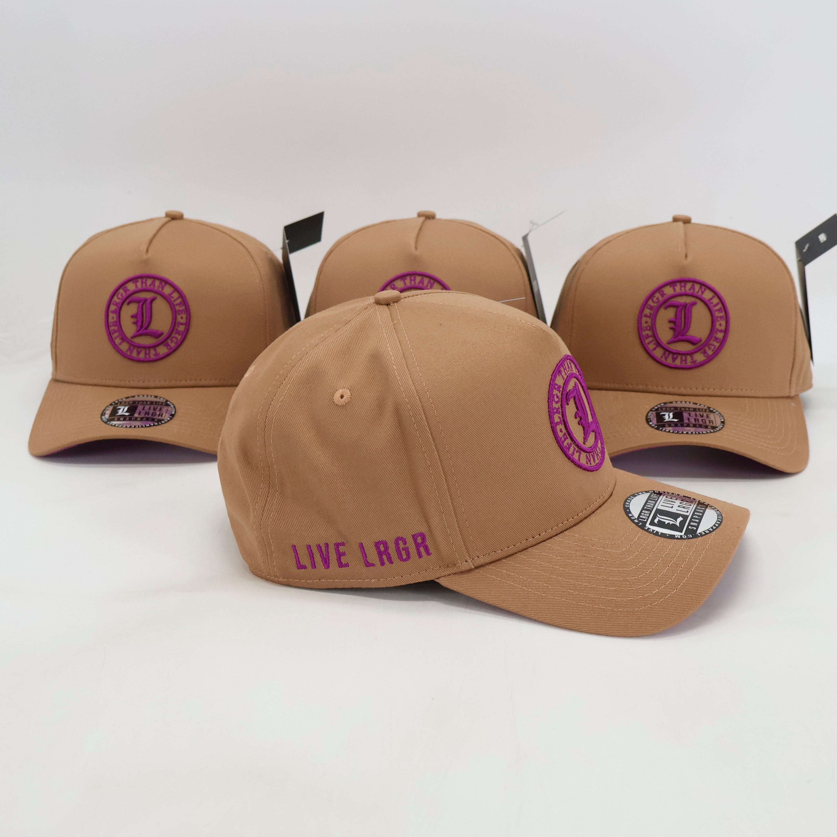 Four tan baseball caps with purple logos and text on a white background