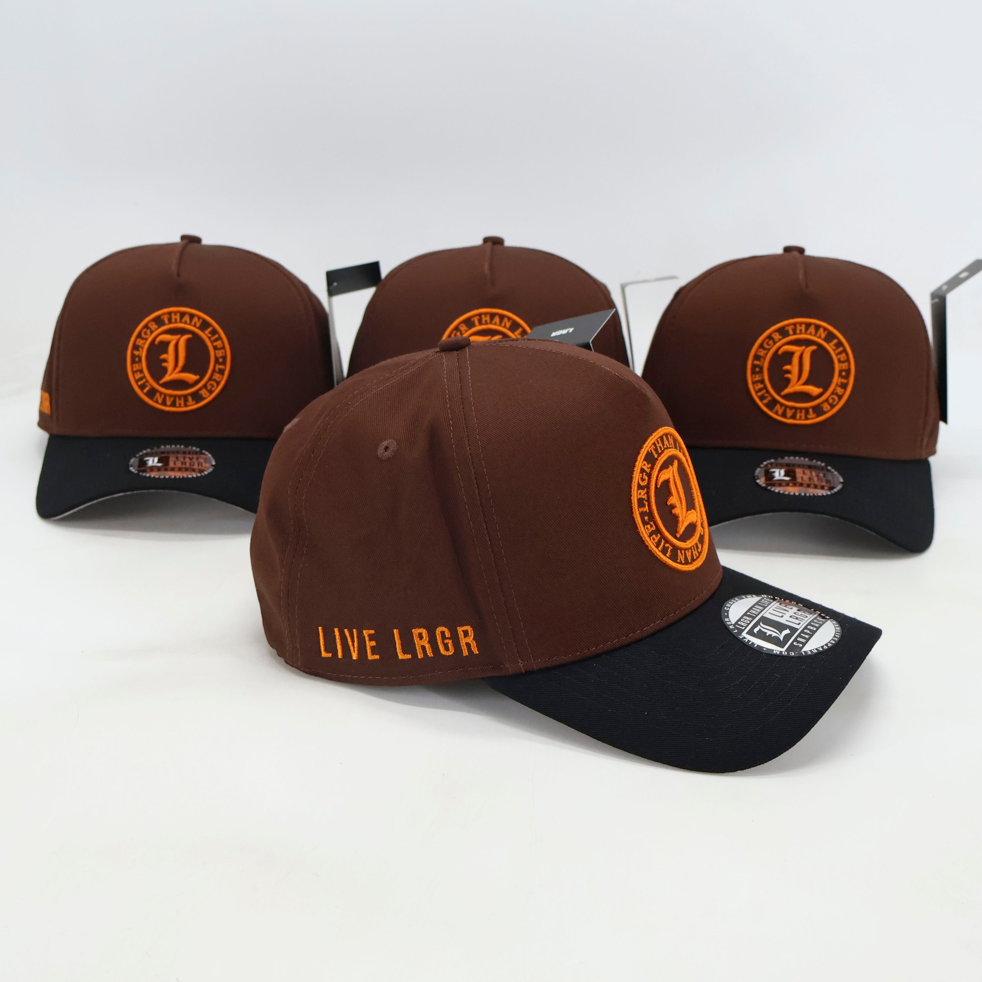 Brown and black baseball caps with orange logo and text on a white background