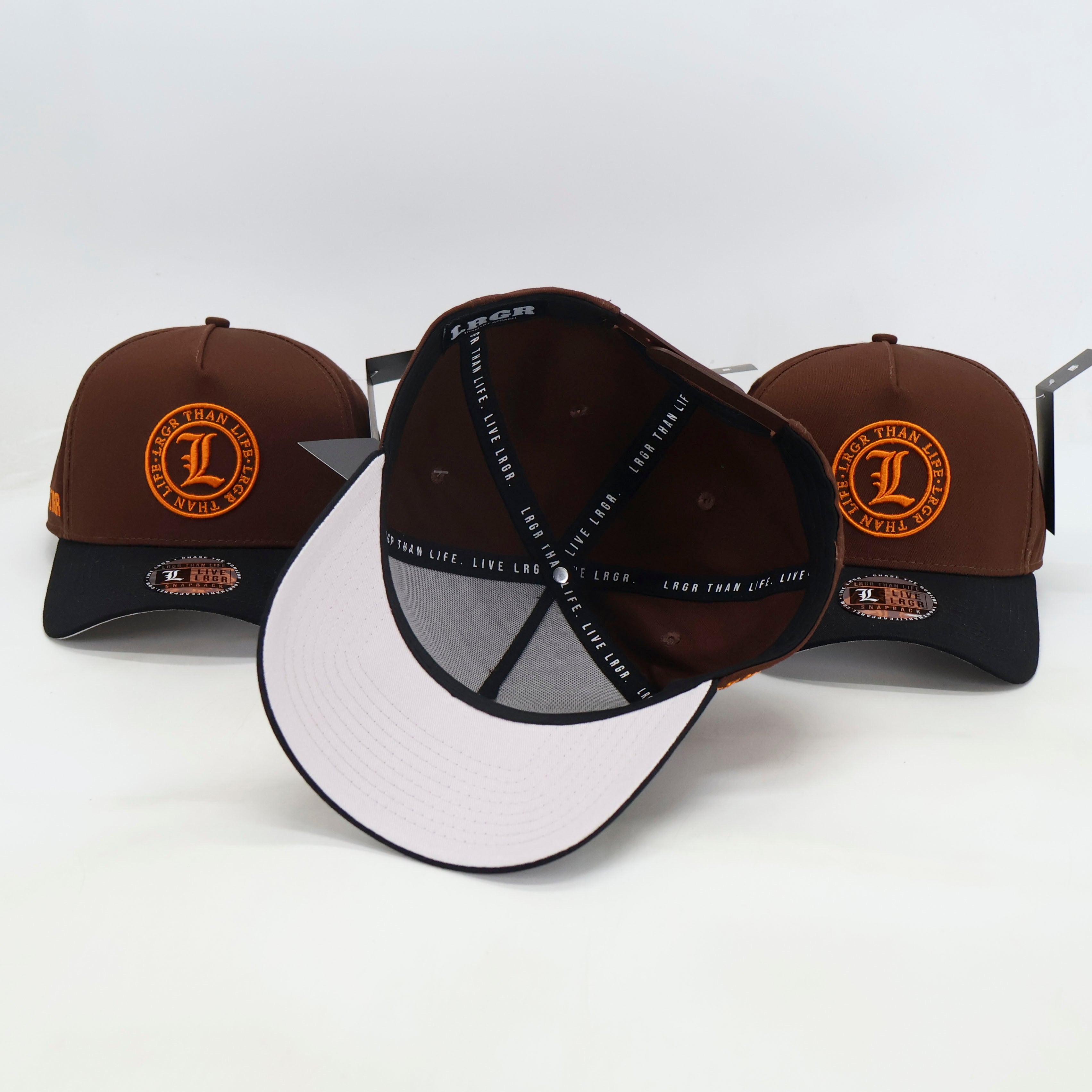 Three baseball caps with different color combinations on a white background