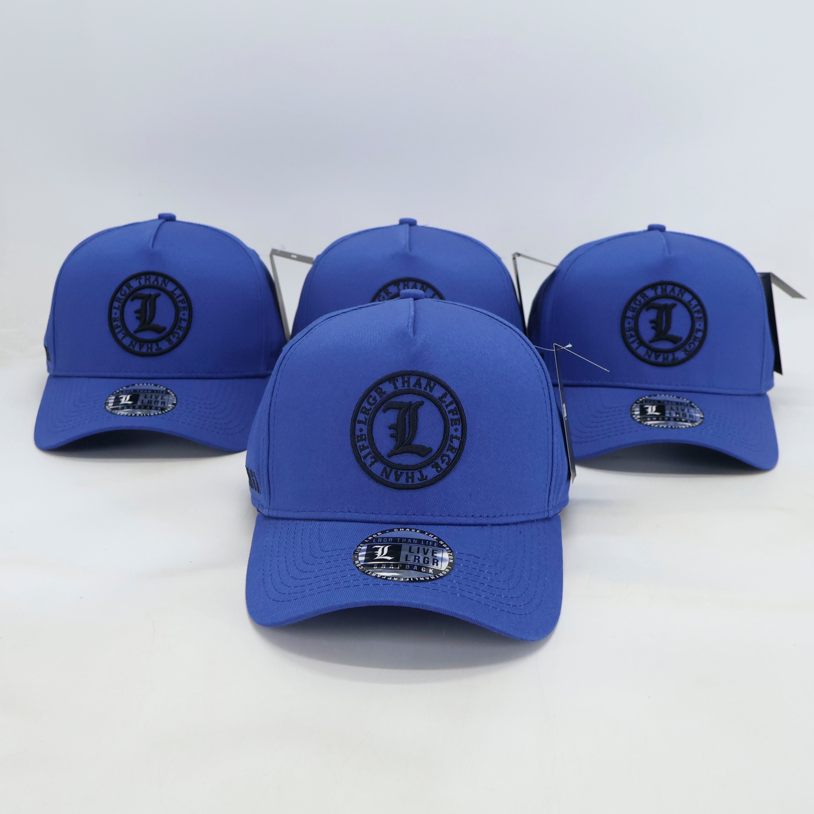 Four blue baseball caps with a logo on a white background
