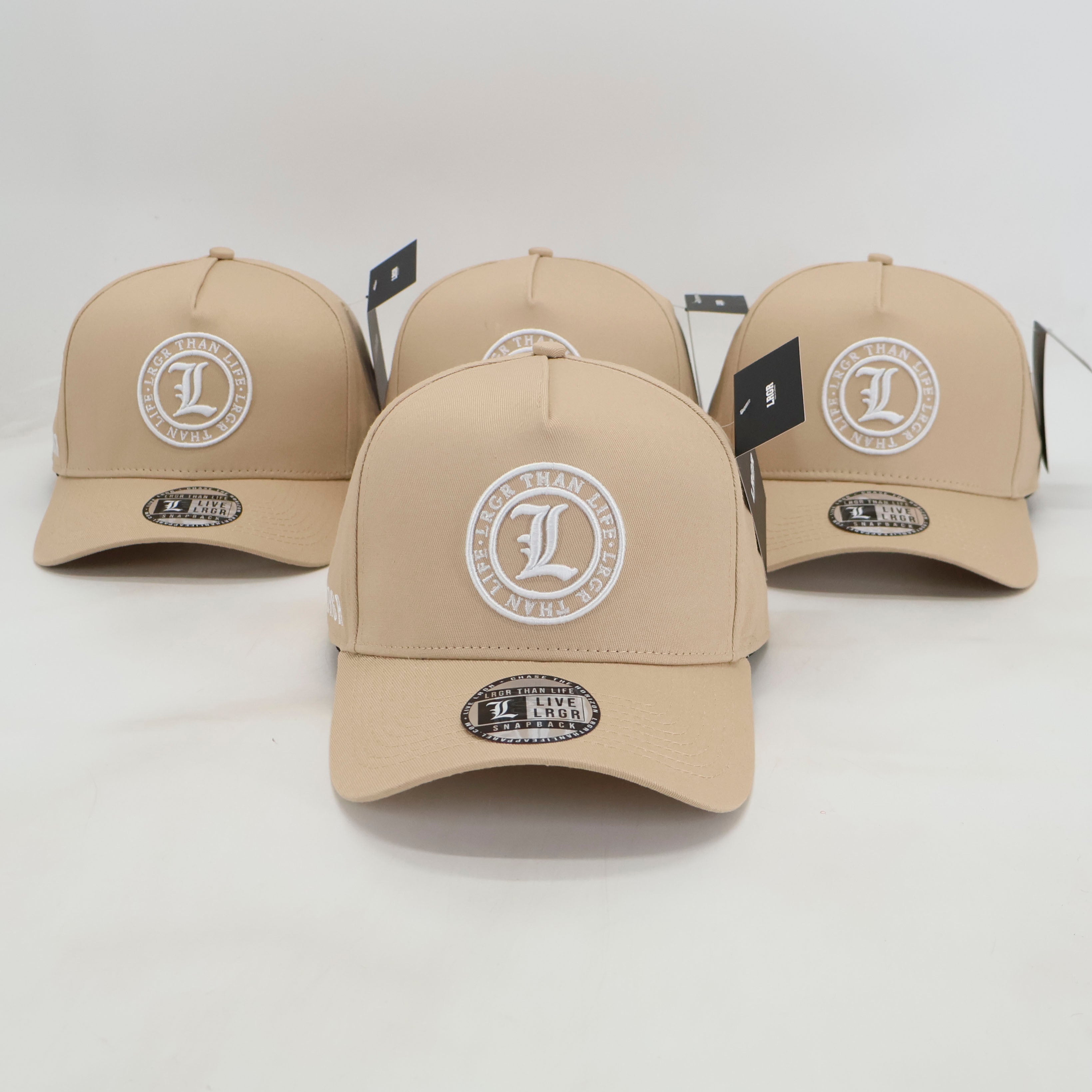 Four beige caps with a logo on a white background