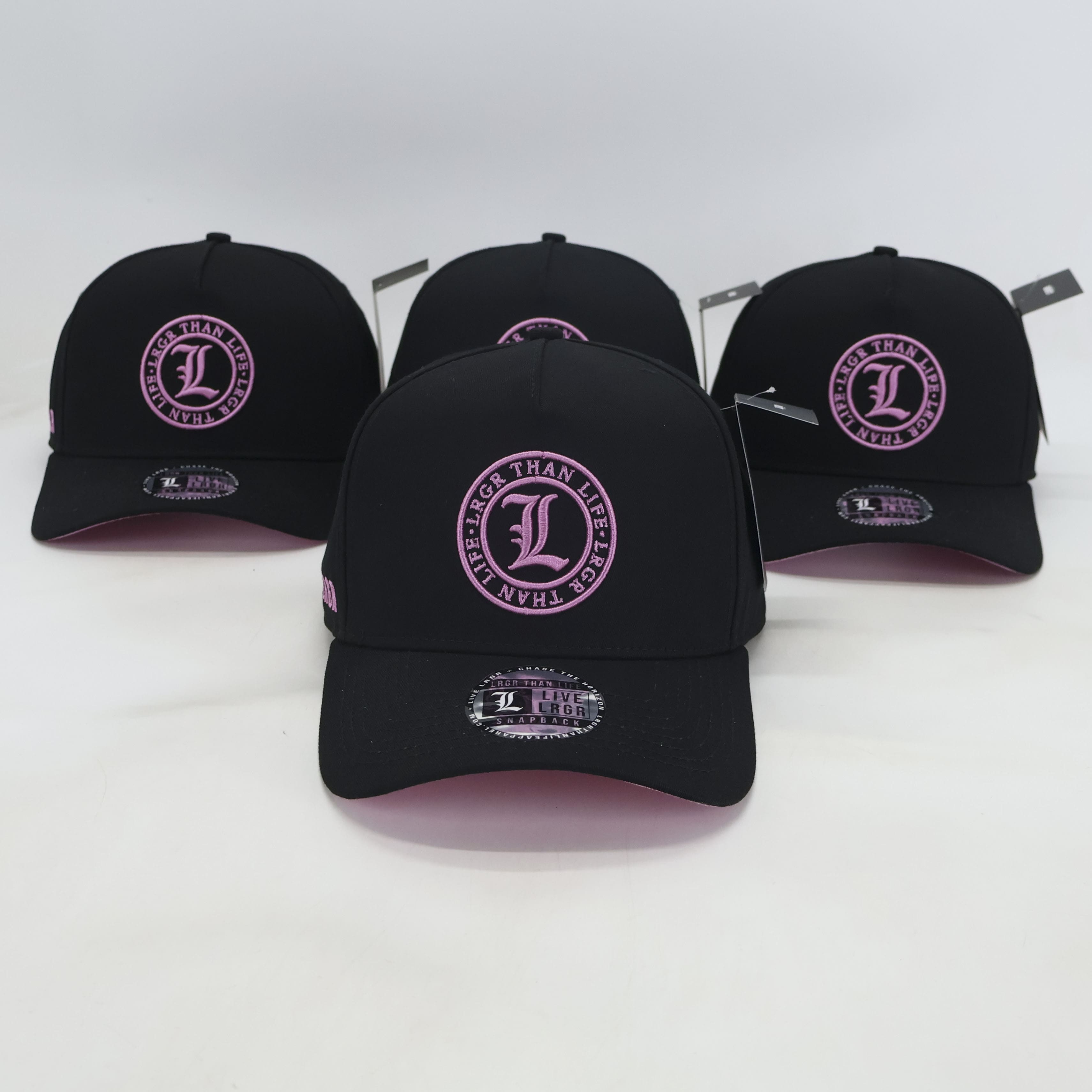 Black baseball caps with pink logos on a white background