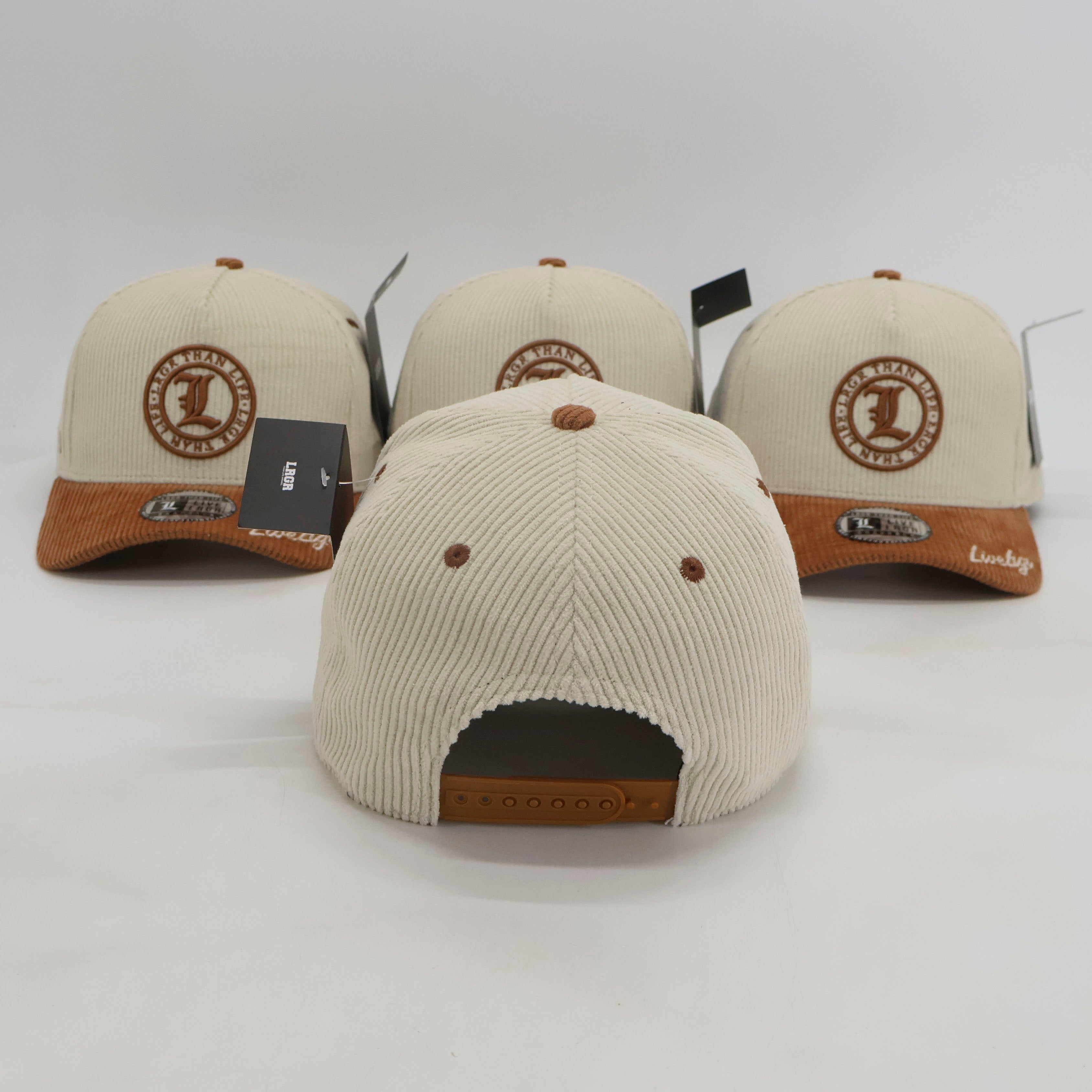 Four beige and brown baseball caps with a logo on a white background