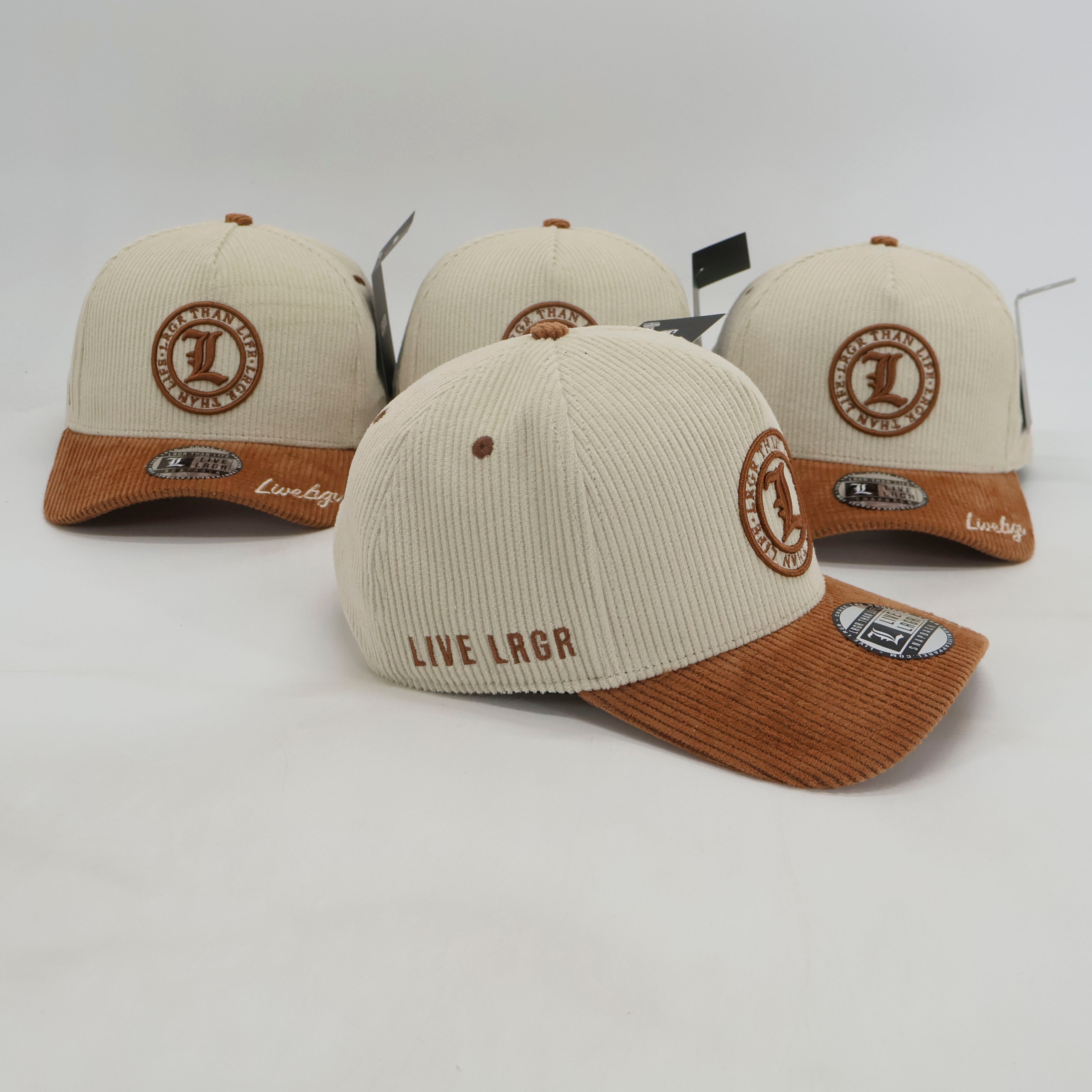 Three beige and brown caps with branding on a light gray background