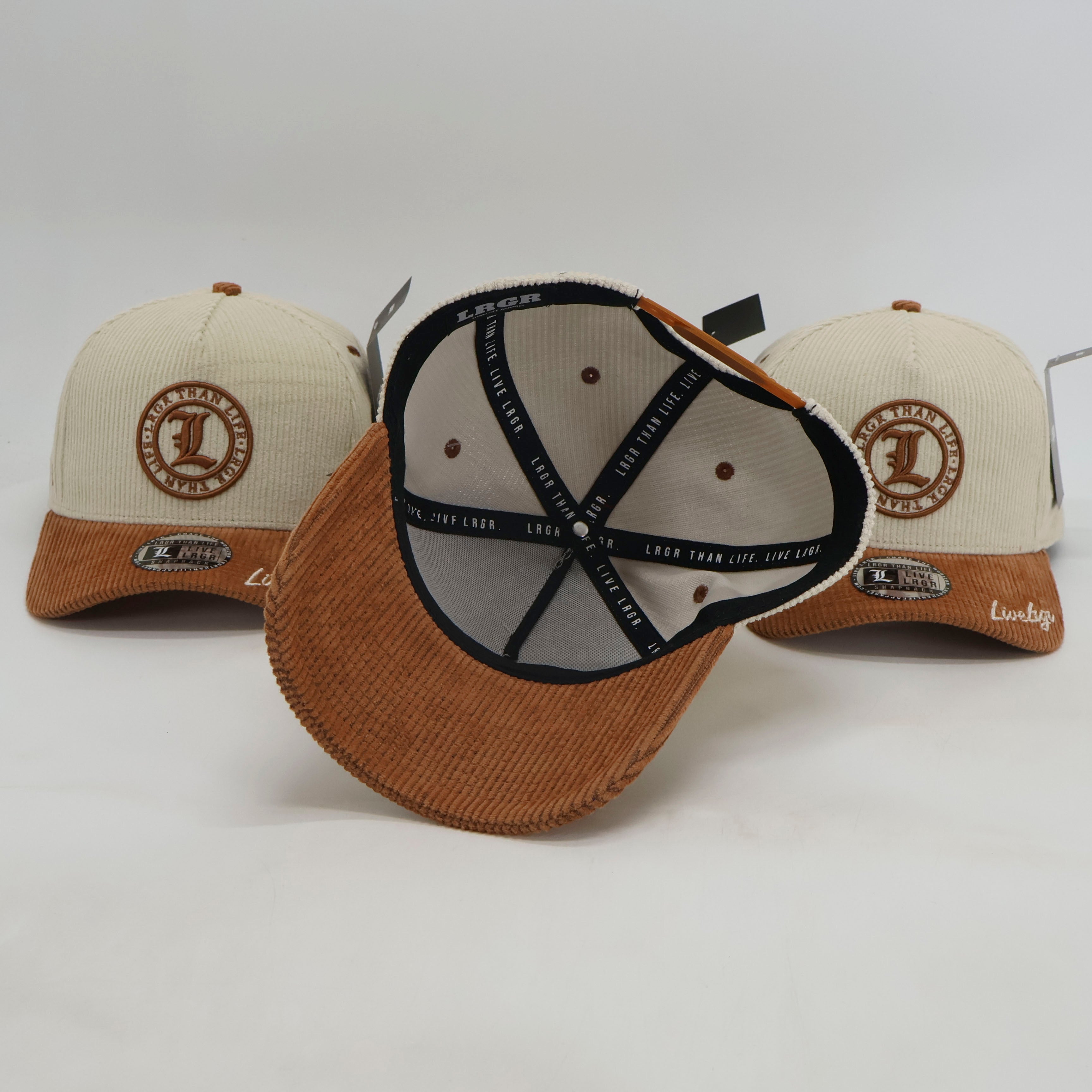 Three caps with brown and beige designs on a white background