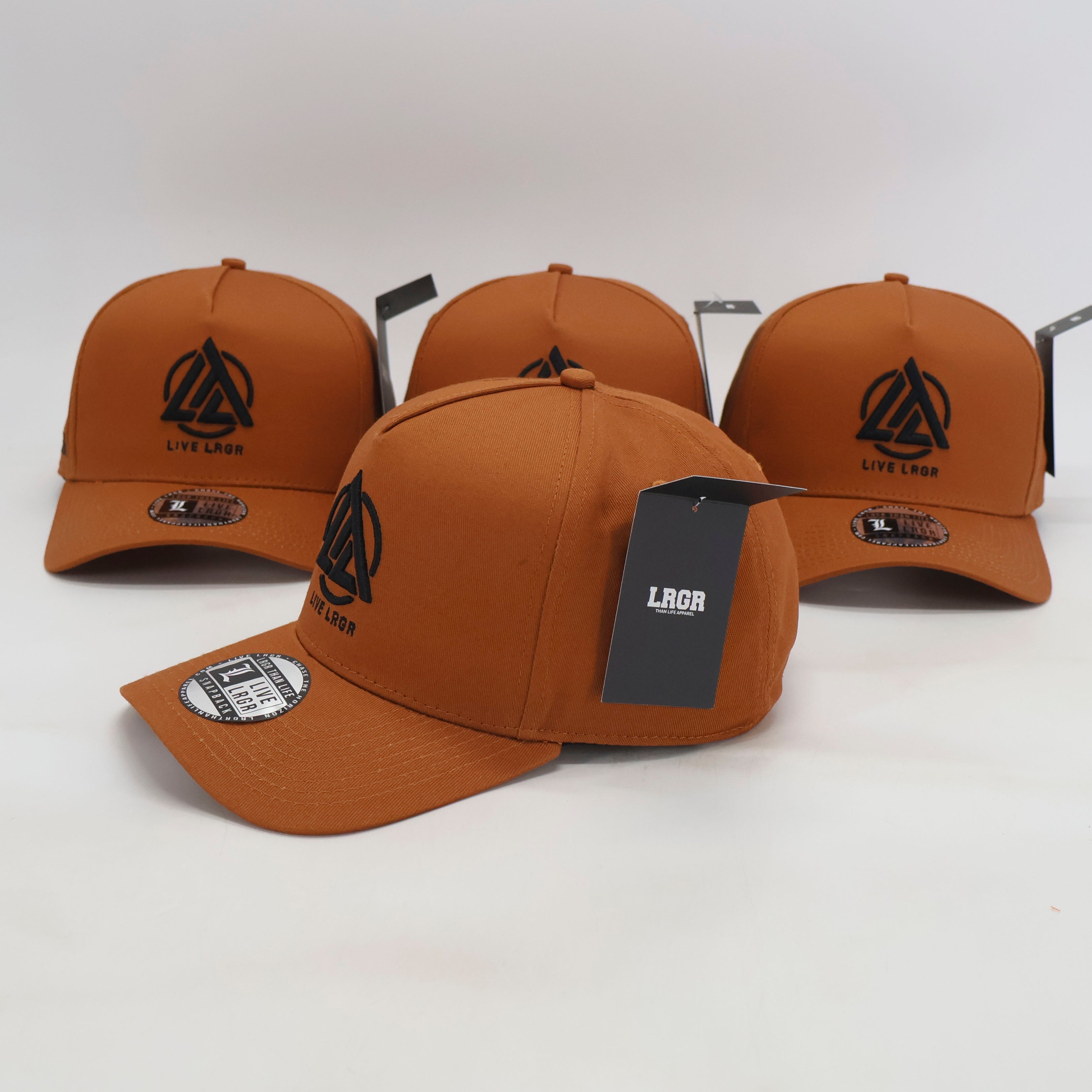 Four brown caps with a logo on a white background