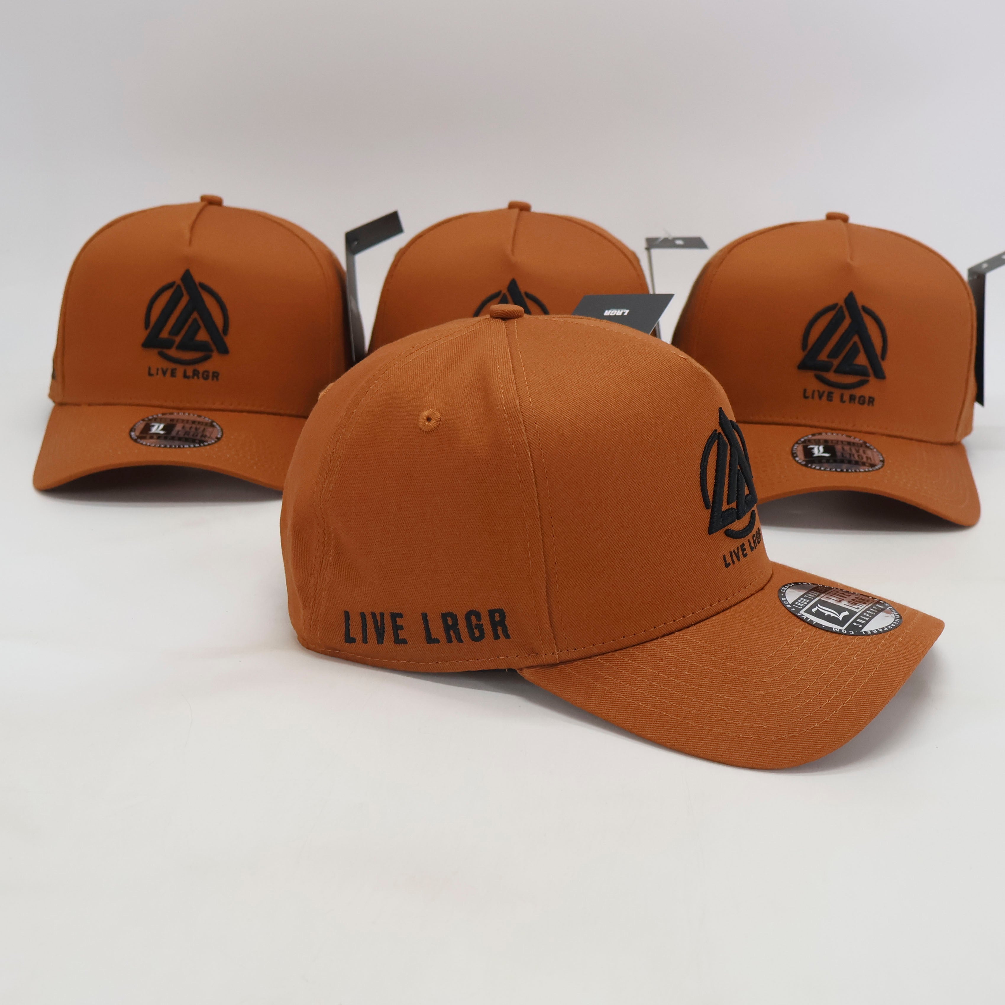 Brown caps with 'LIVE LORQ' logo on a white background