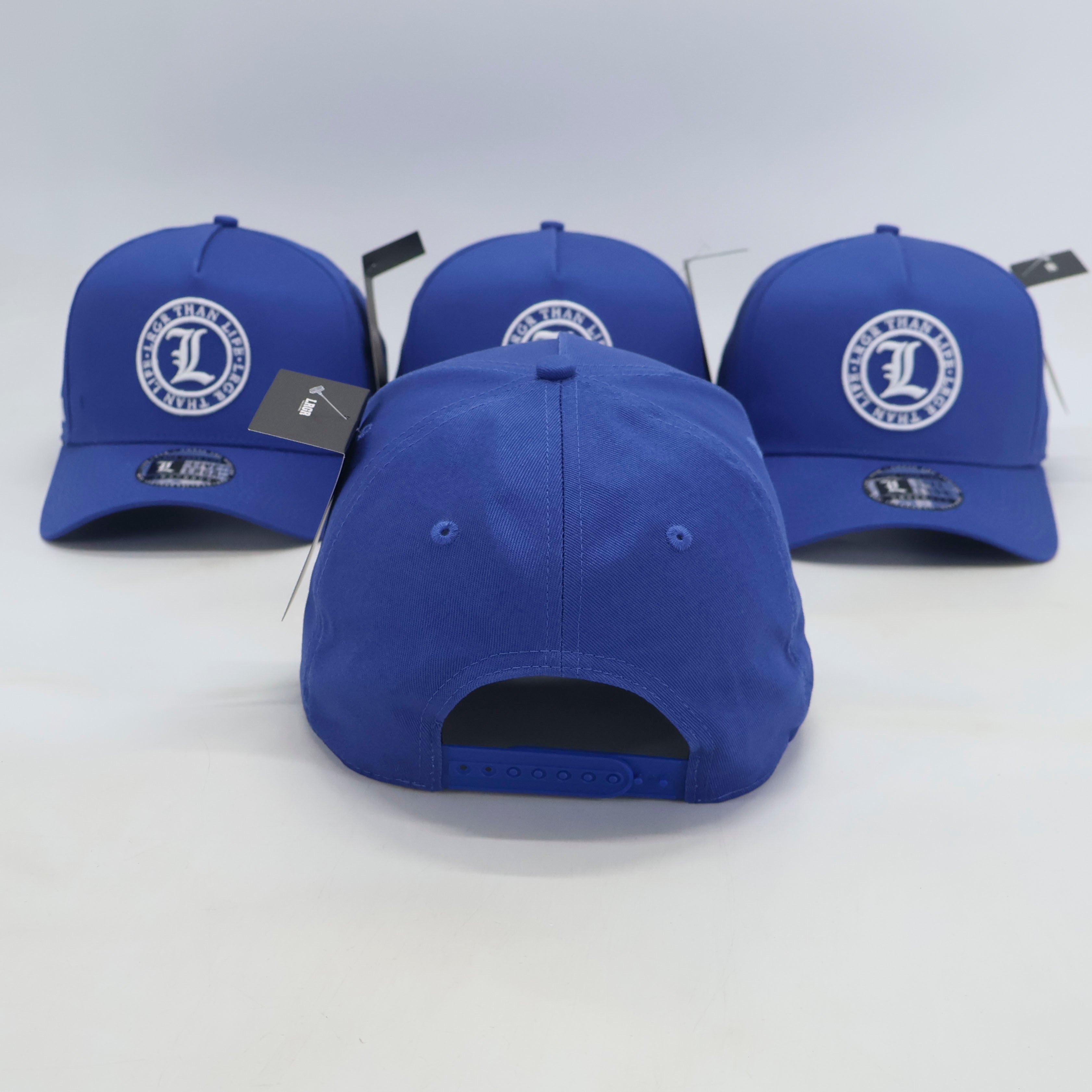 Three blue baseball caps with a logo on a white background