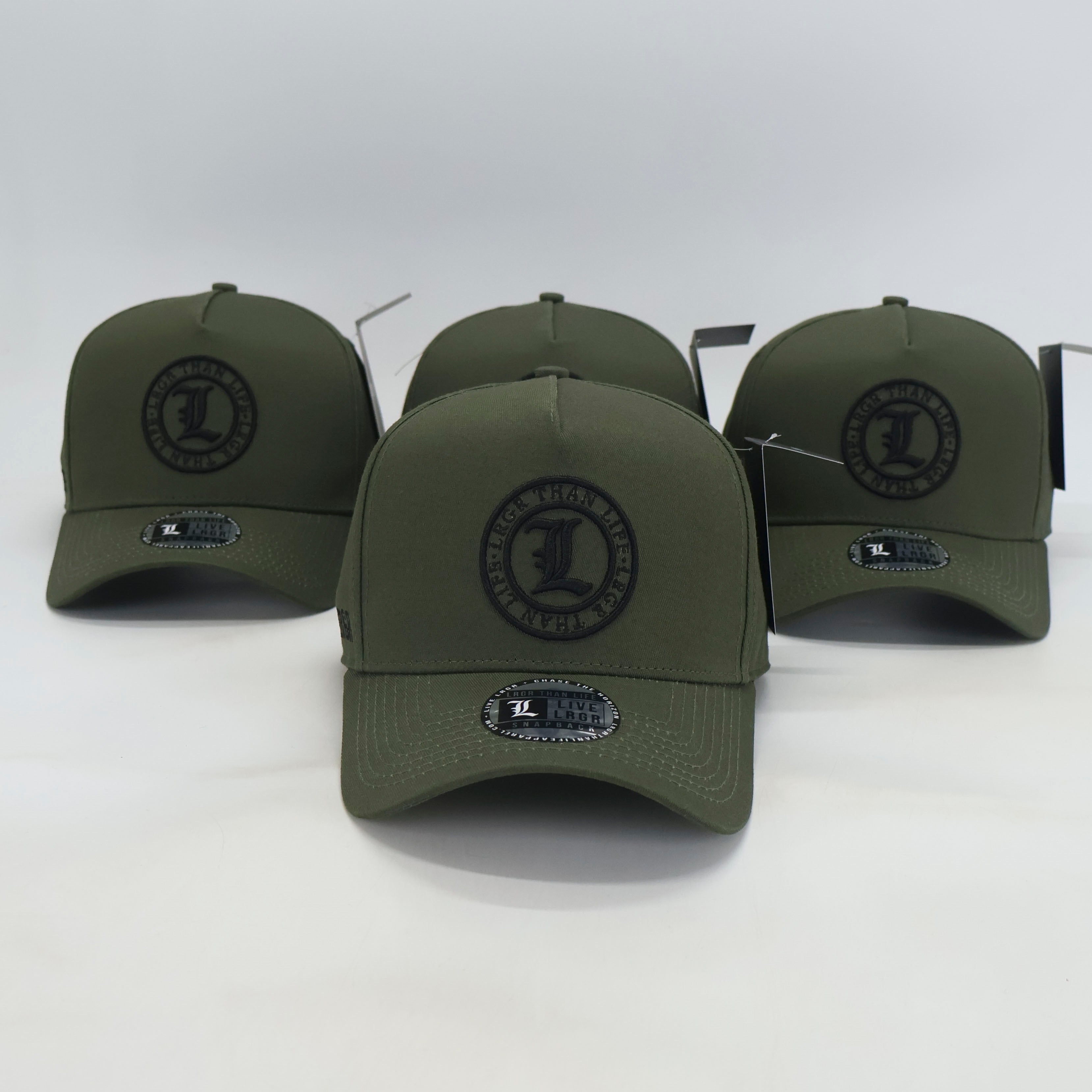 Four green baseball caps with a logo on a white background